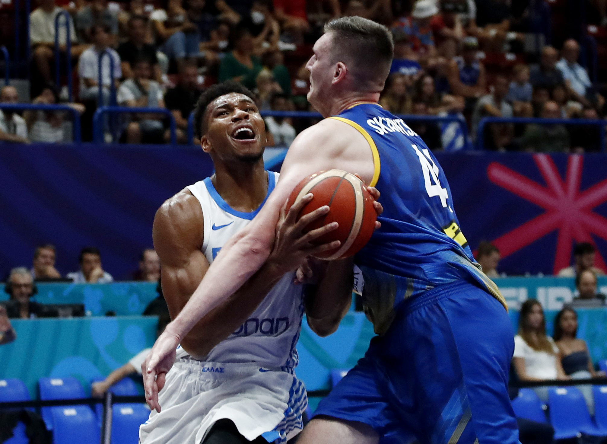 Basketball - EuroBasket Championship - Group C - Greece v Ukraine - Mediolanum Forum, Assago, Italy - September 6, 2022 Greece's Giannis Antetokounmpo in action with Ukraine's Dmytro Skapintsev REUTERS