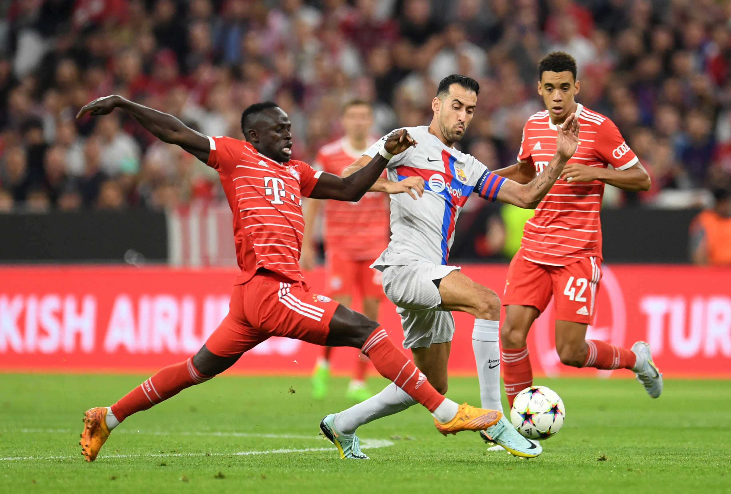Soccer Football - Champions League - Group C - Bayern Munich v FC Barcelona - Allianz Arena, Munich, Germany - September 13, 2022 Bayern Munich's Sadio Mane in action with FC Barcelona's Sergio Busquets REUTERS