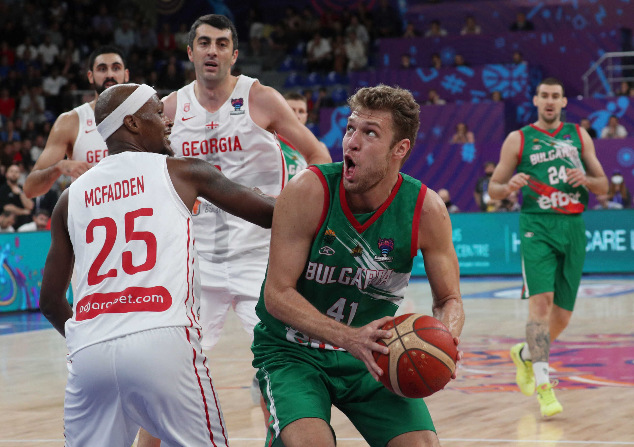 Basketball - EuroBasket Championship - Group A - Georgia v Bulgaria - Tbilisi Arena, Tbilisi, Georgia - September 6, 2022 Bulgaria's Aleksandar Vezenkov in action with Georgia's Thad McFadden REUTERS