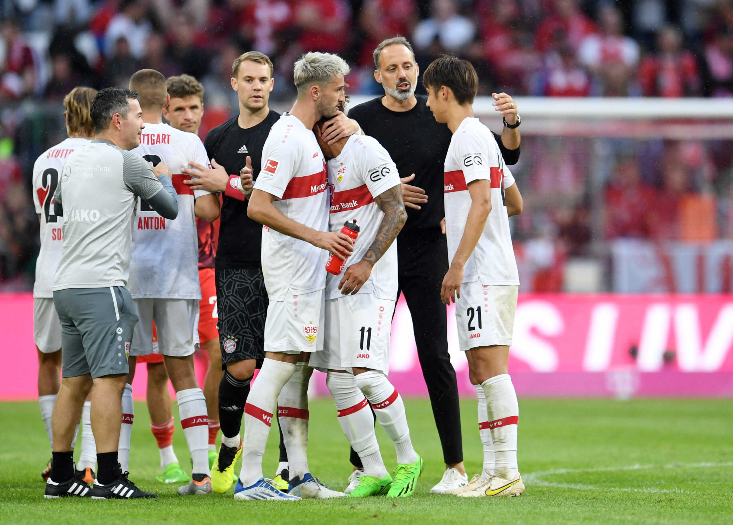 Soccer Football - Bundesliga - Bayern Munich v VfB Stuttgart - Allianz Arena, Munich, Germany - September 10, 2022 VfB Stuttgart coach Pellegrino Matarazzo with Hiroki Ito after the match as Bayern Munich's Manuel Neuer shakes hands with Waldemar Anton REUTERS
