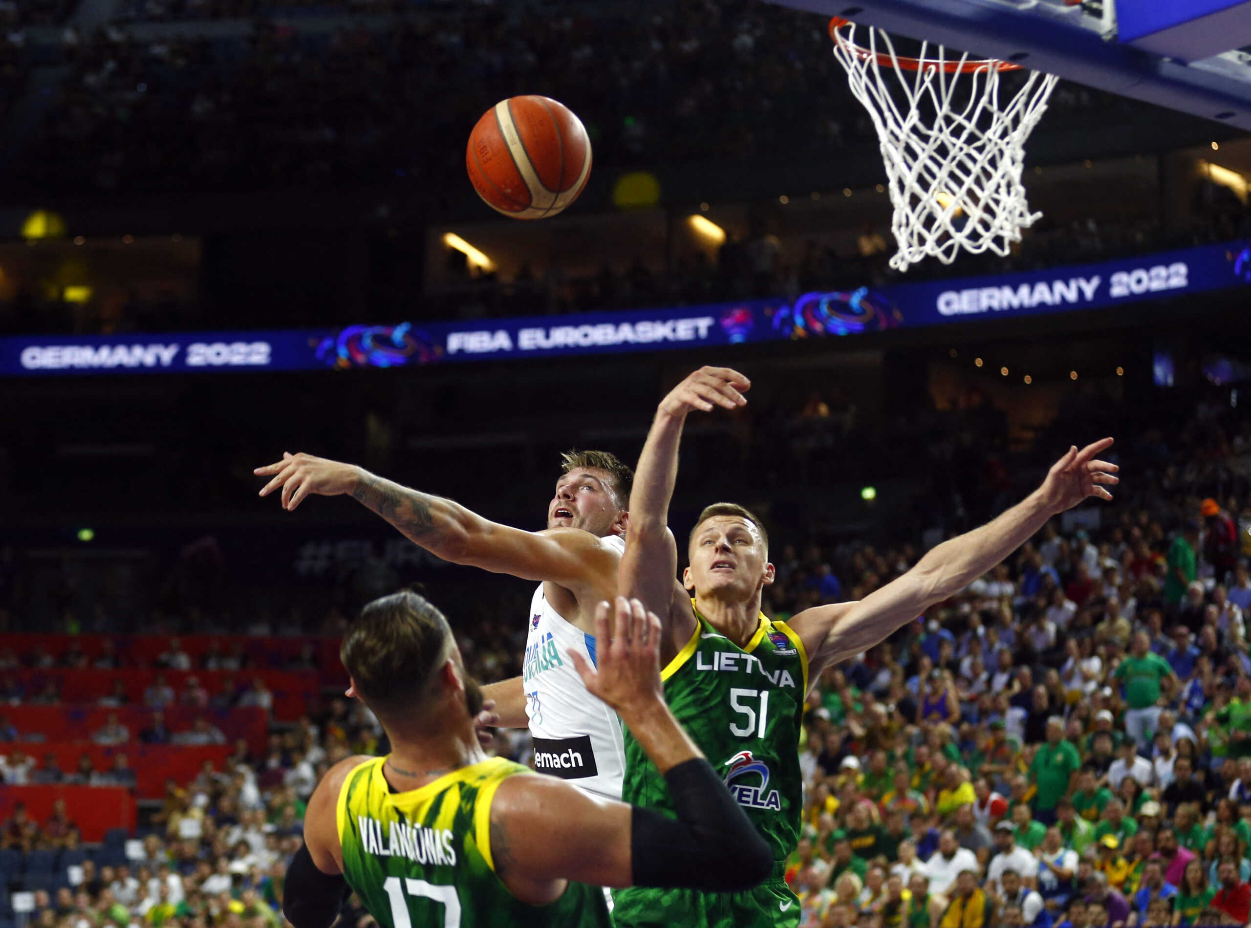 Basketball - EuroBasket Championship - Group A - Slovenia v Lithuania - Cologne Arena, Cologne, Germany- September 1, 2022 Slovenia's Luka Doncic in action with Lithuania's Arnas Butkevicius REUTERS