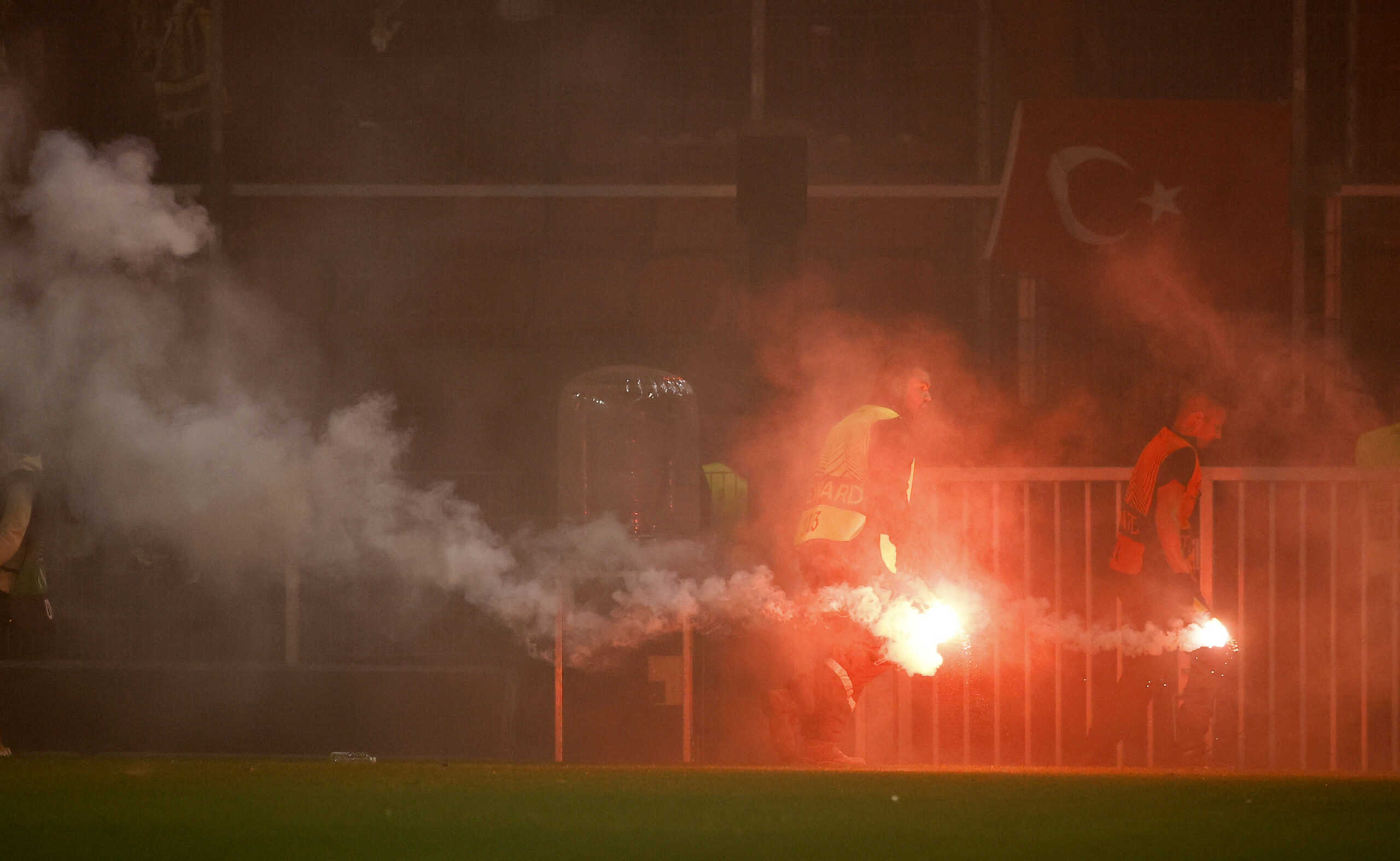 Soccer Football - Europa League - Group B - Stade Rennes v Fenerbahce - Roazhon Park, Rennes, France - September 15, 2022 Stewards remove flares from the pitch at the start of the match REUTERS