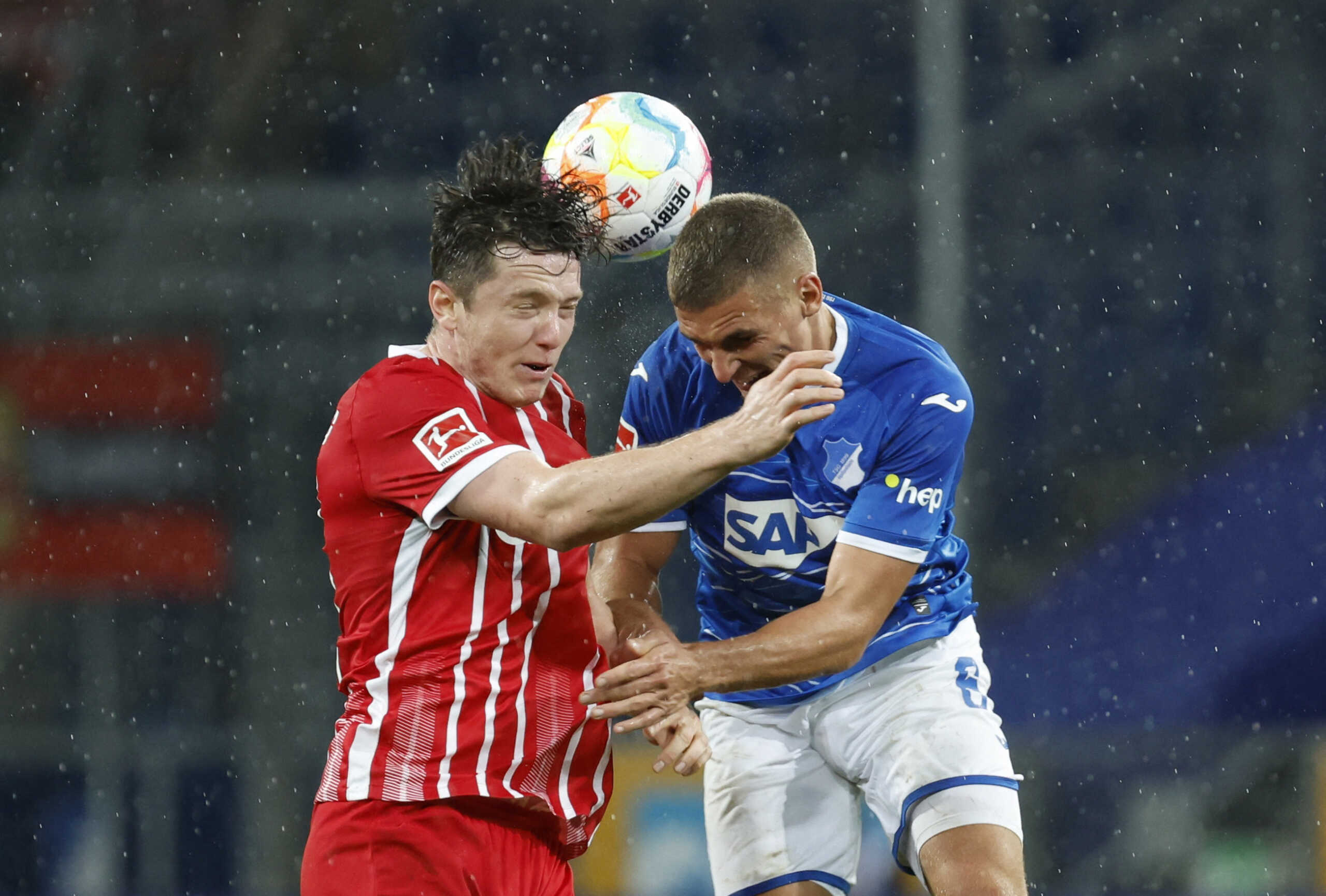 Soccer Football - Bundesliga - TSG 1899 Hoffenheim v SC Freiburg - PreZero Arena, Sinsheim, Germany - September 18, 2022 SC Freiburg's Michael Gregoritsch in action with TSG 1899 Hoffenheim's Grischa Promel REUTERS