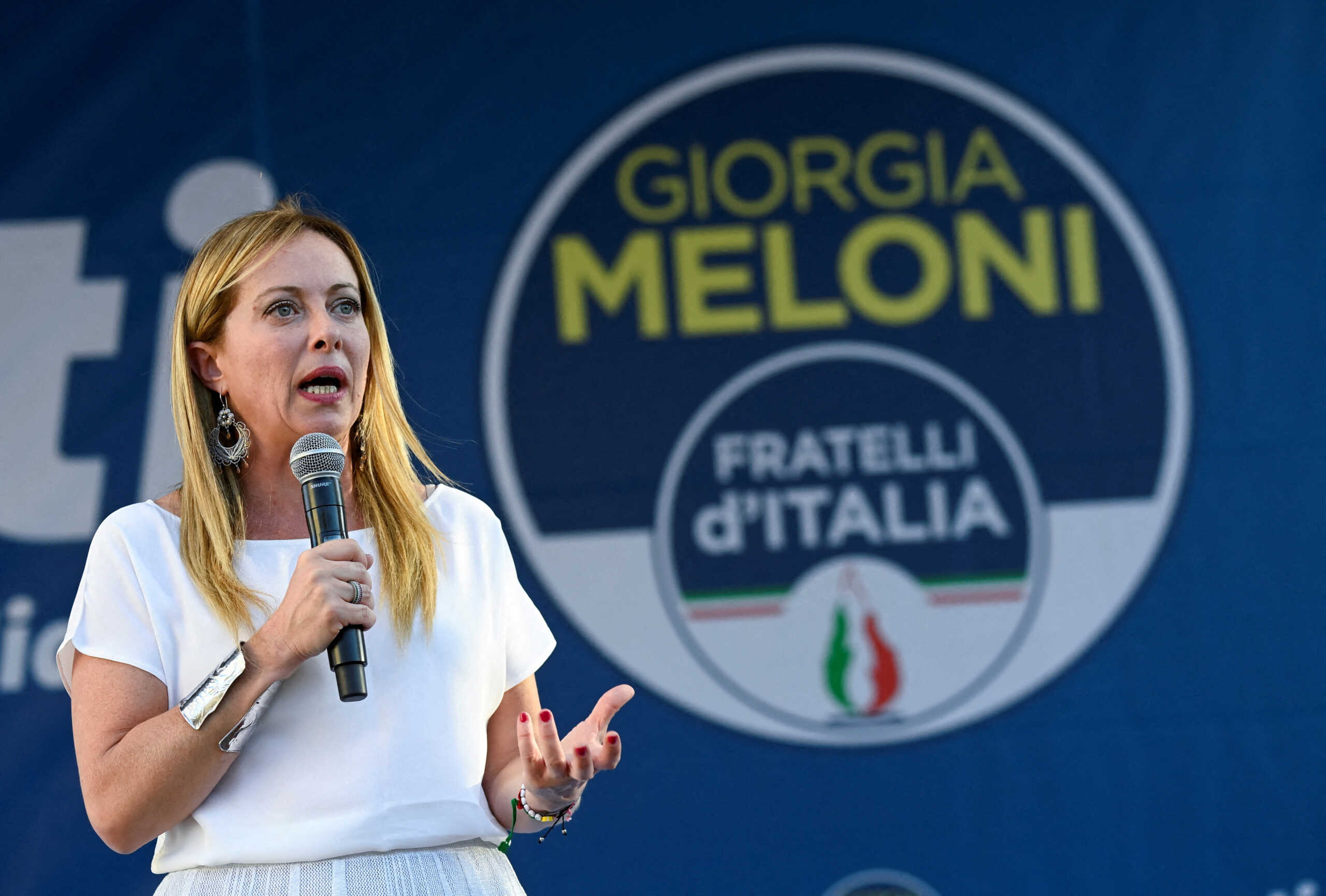 FILE PHOTO: Giorgia Meloni, leader of the far-right Brothers of Italy party, speaks during a rally in Duomo square ahead of the Sept. 25 snap election, in Milan, Italy, September 11, 2022. REUTERS