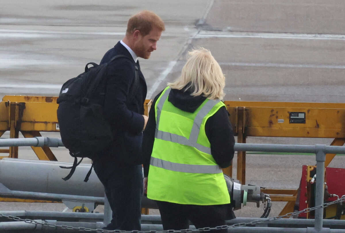 Britain's Prince Harry boards a plane at Aberdeen International Airport, following the passing of Britain's Queen Elizabeth, in Aberdeen, Britain, September 9, 2022. REUTERS