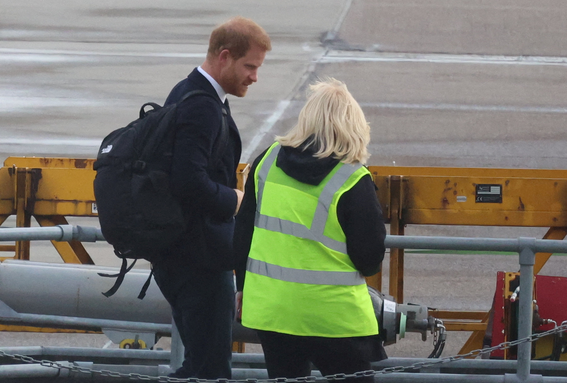 Britain's Prince Harry boards a plane at Aberdeen International Airport, following the passing of Britain's Queen Elizabeth, in Aberdeen, Britain, September 9, 2022. REUTERS