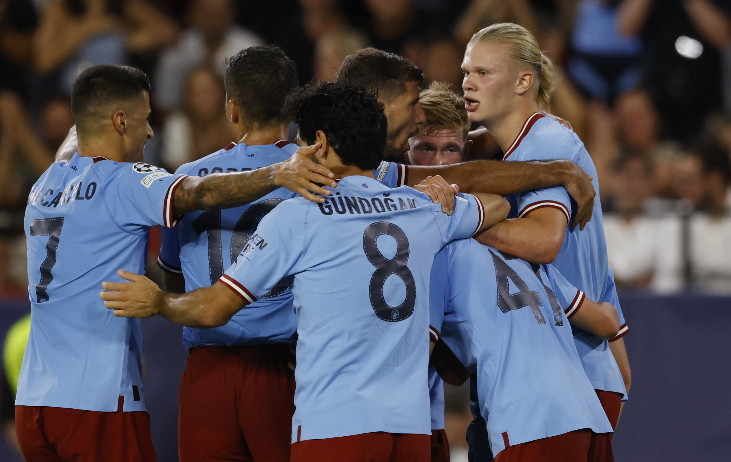 Soccer Football - Champions League - Group G - Sevilla v Manchester City - Ramon Sanchez Pizjuan, Seville, Spain - September 6, 2022  Manchester City's Erling Braut Haaland celebrates scoring their third goal with teammates REUTERS