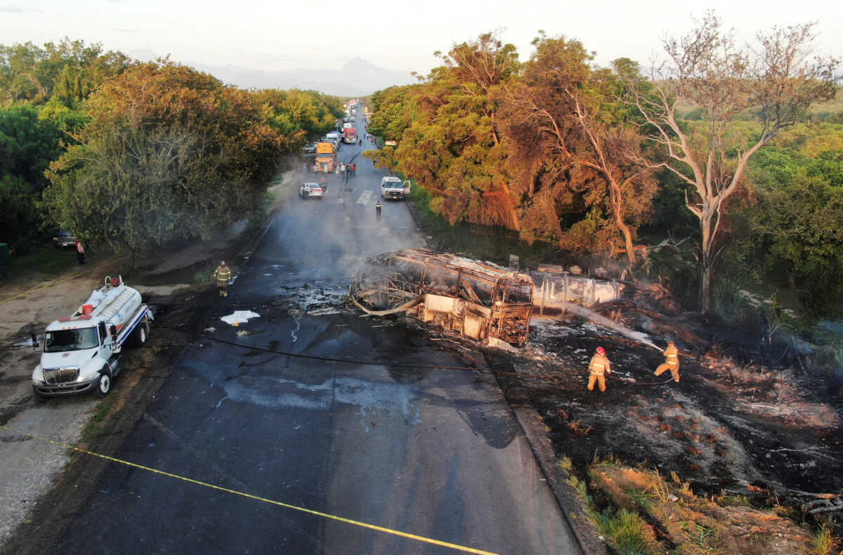 Firefighters work at the area where several people died after a passenger truck collided with the trailer of a fuel truck, in Hidalgo, state of Tamaulipas, Mexico September 10, 2022. REUTERS
