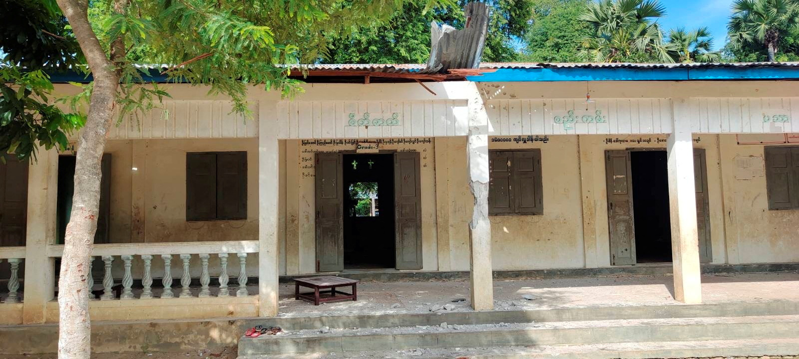 A table and debris are seen at the entrance of a local school that was hit by an air attack carried out by the Myanmar military against the People Defense Force, in Sagaing, Myanmar September 16, 2022 in this social media video still image obtained by REUTERS. NO RESALES. NO ARCHIVES. THIS IMAGE HAS BEEN SUPPLIED BY A THIRD PARTY.