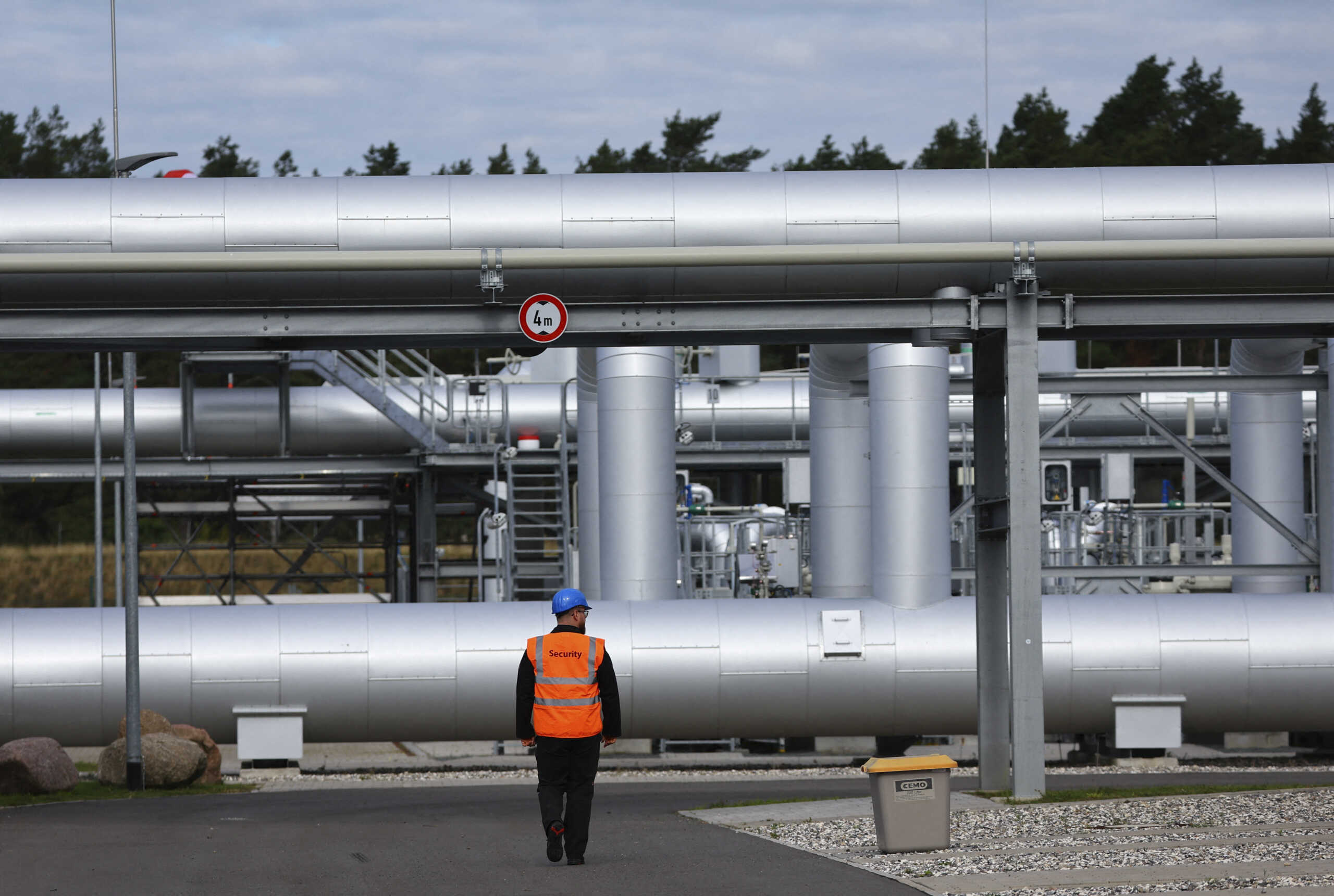 FILE PHOTO: Security walks in front of the landfall facility of the Baltic Sea gas pipeline Nord Stream 2 in Lubmin, Germany, September 19, 2022. REUTERS