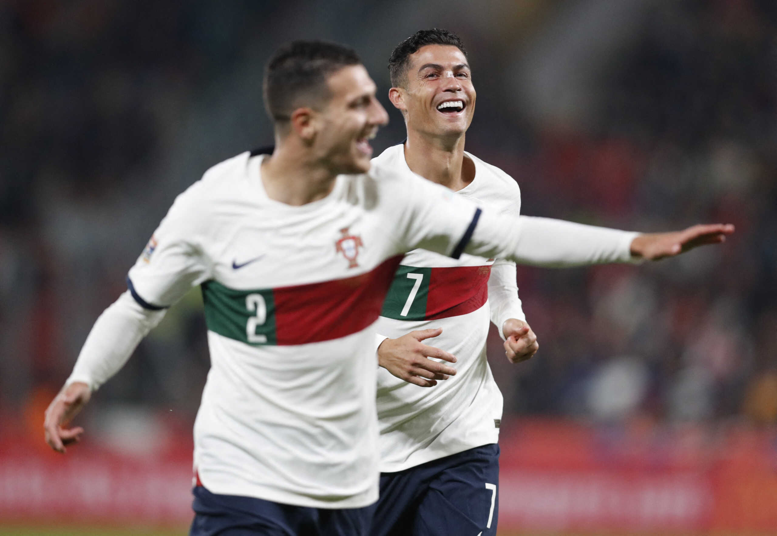Soccer Football - UEFA Nations League - Group B - Czech Republic v Portugal - Eden Arena, Prague, Czech Republic - September 24, 2022 Portugal's Diogo Dalot celebrates scoring their third goal with Cristiano Ronaldo REUTERS