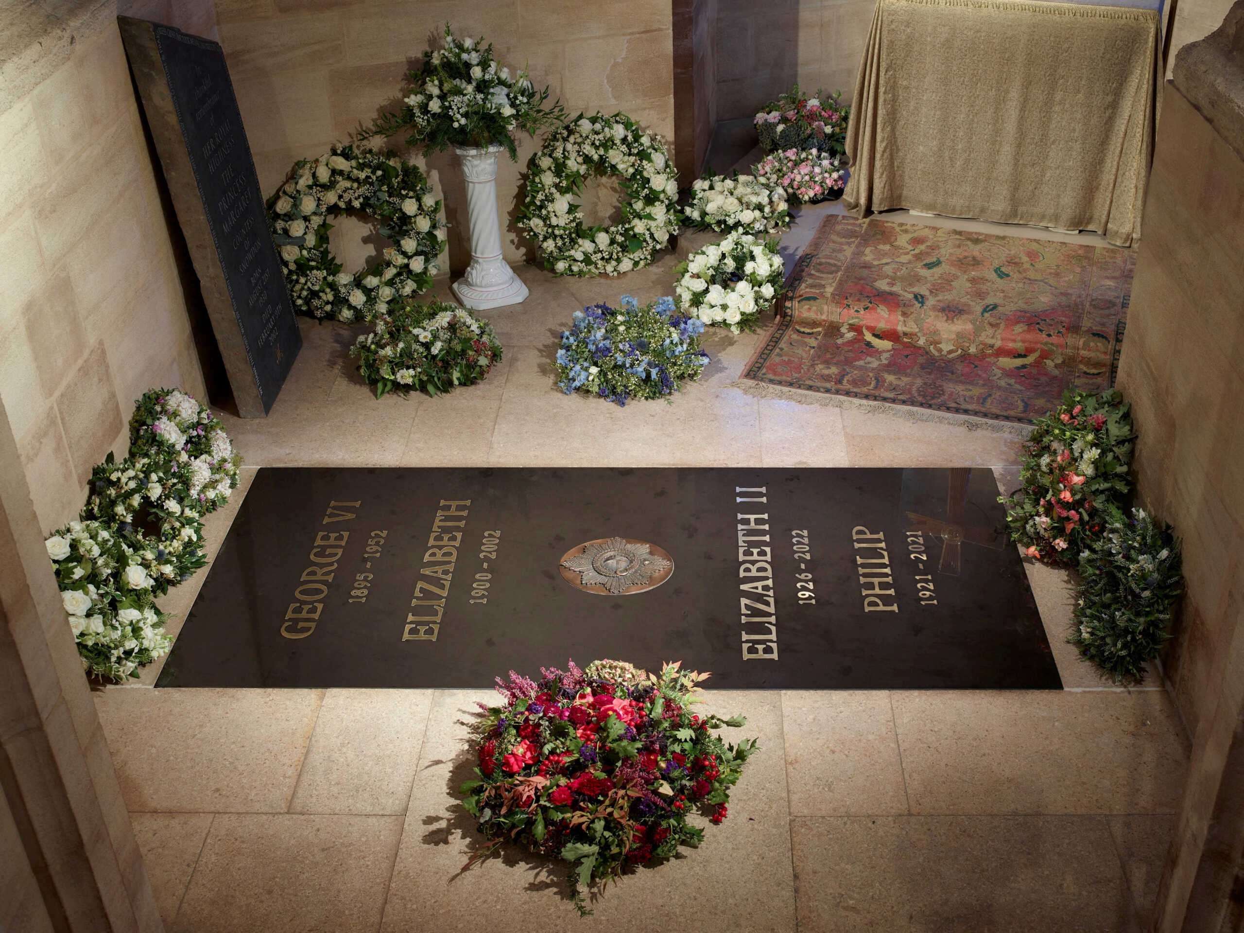 Handout photo from Buckingham Palace of the ledger stone at the King George VI Memorial Chapel, St George's Chapel, Windsor Castle, Britain in this undated handout released September 24, 2022. Royal Collection Trust