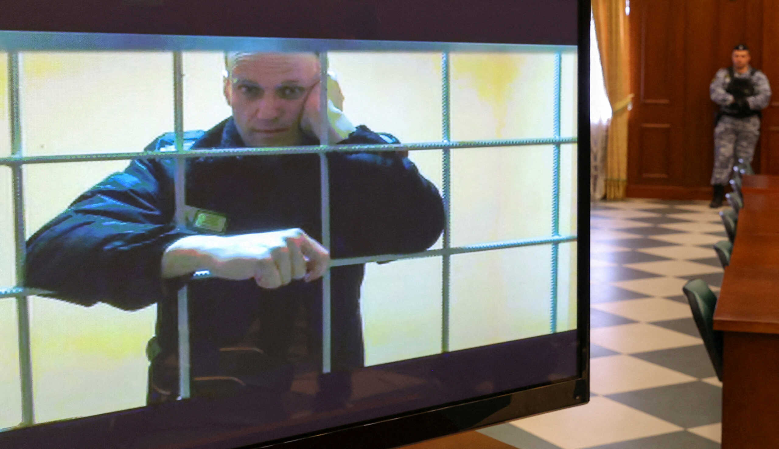 FILE PHOTO: Russian opposition leader Alexei Navalny is seen on a screen via a video link from the IK-2 corrective penal colony in Pokrov during a court hearing to consider an appeal against his prison sentence in Moscow, Russia May 24, 2022. REUTERS