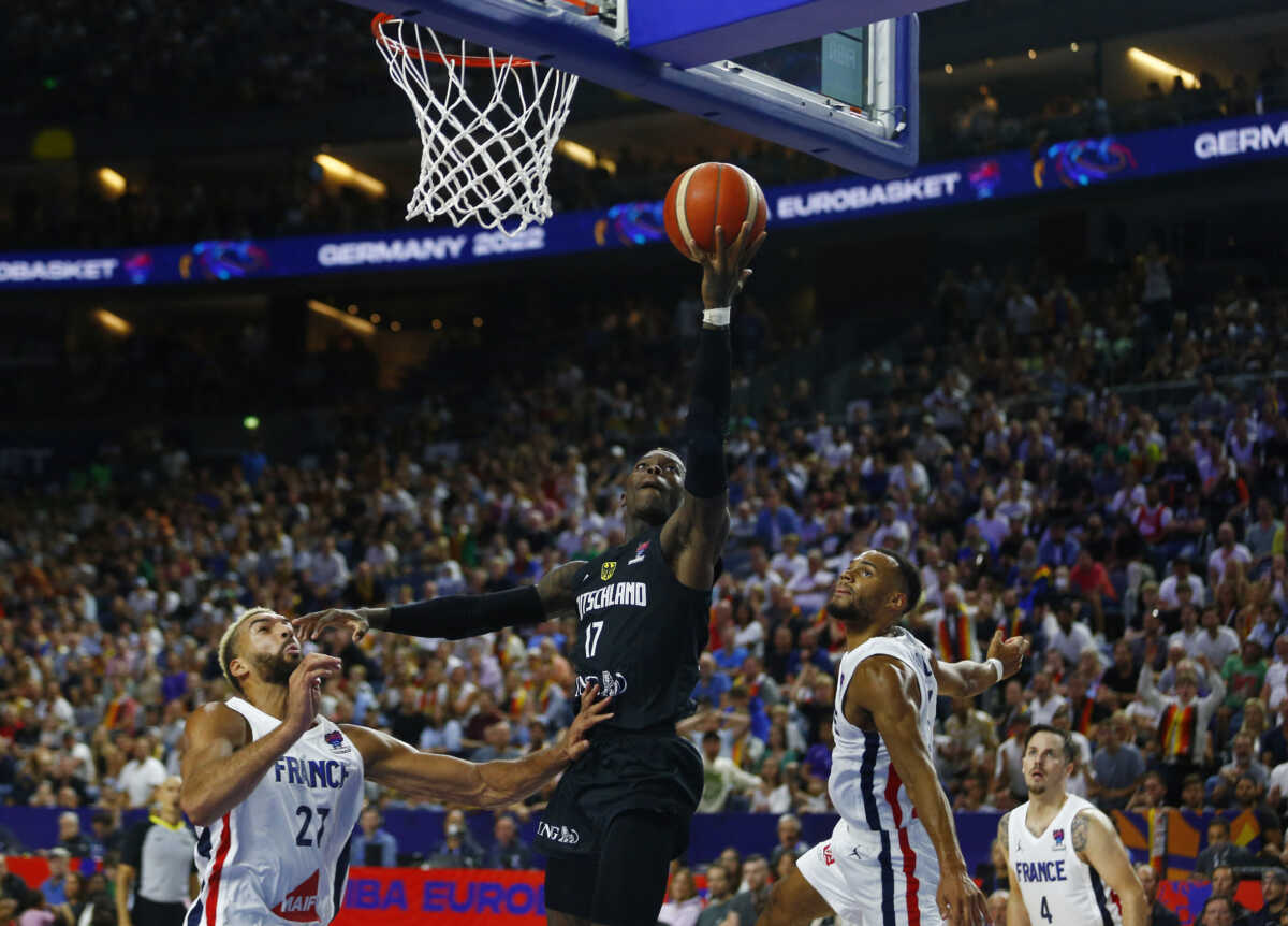 Basketball - EuroBasket Championship - Group B - France v Germany - Cologne Arena, Cologne, Germany - September 1, 2022  Germany's Dennis Schroder in action with France's Rudy Gobert REUTERS
