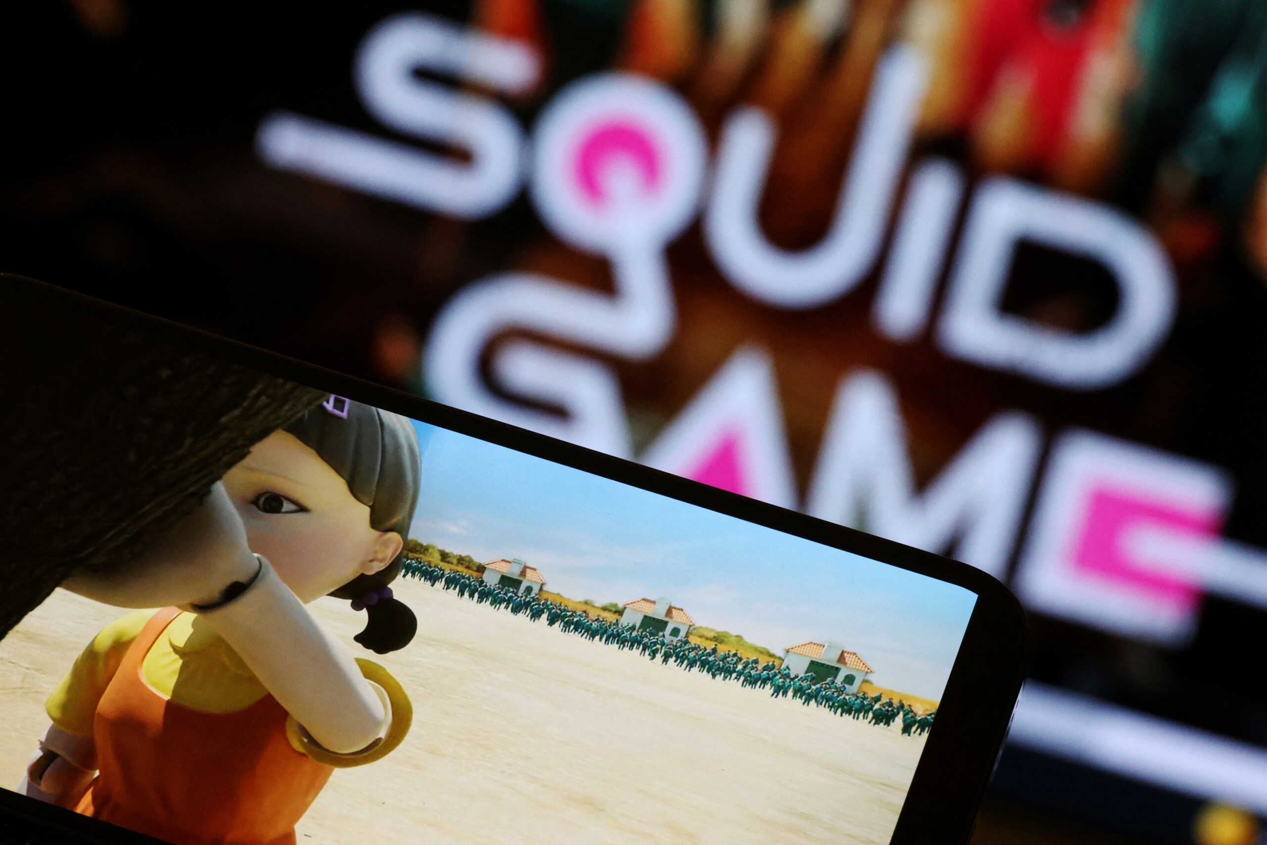 FILE PHOTO: The Netflix series "Squid Game" is played on a mobile phone in this picture illustration taken September 30, 2021.  REUTERS