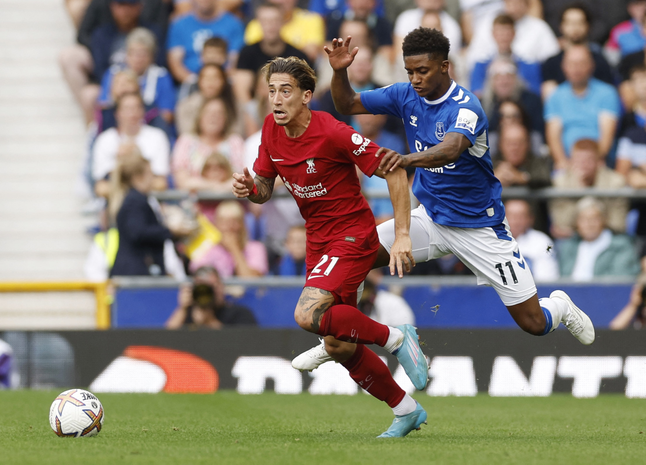 Soccer Football - Premier League - Everton v Liverpool - Goodison Park, Liverpool, Britain - September 3, 2022 Liverpool's Kostas Tsimikas in action with Everton's Demarai Gray Action Images via Reuters