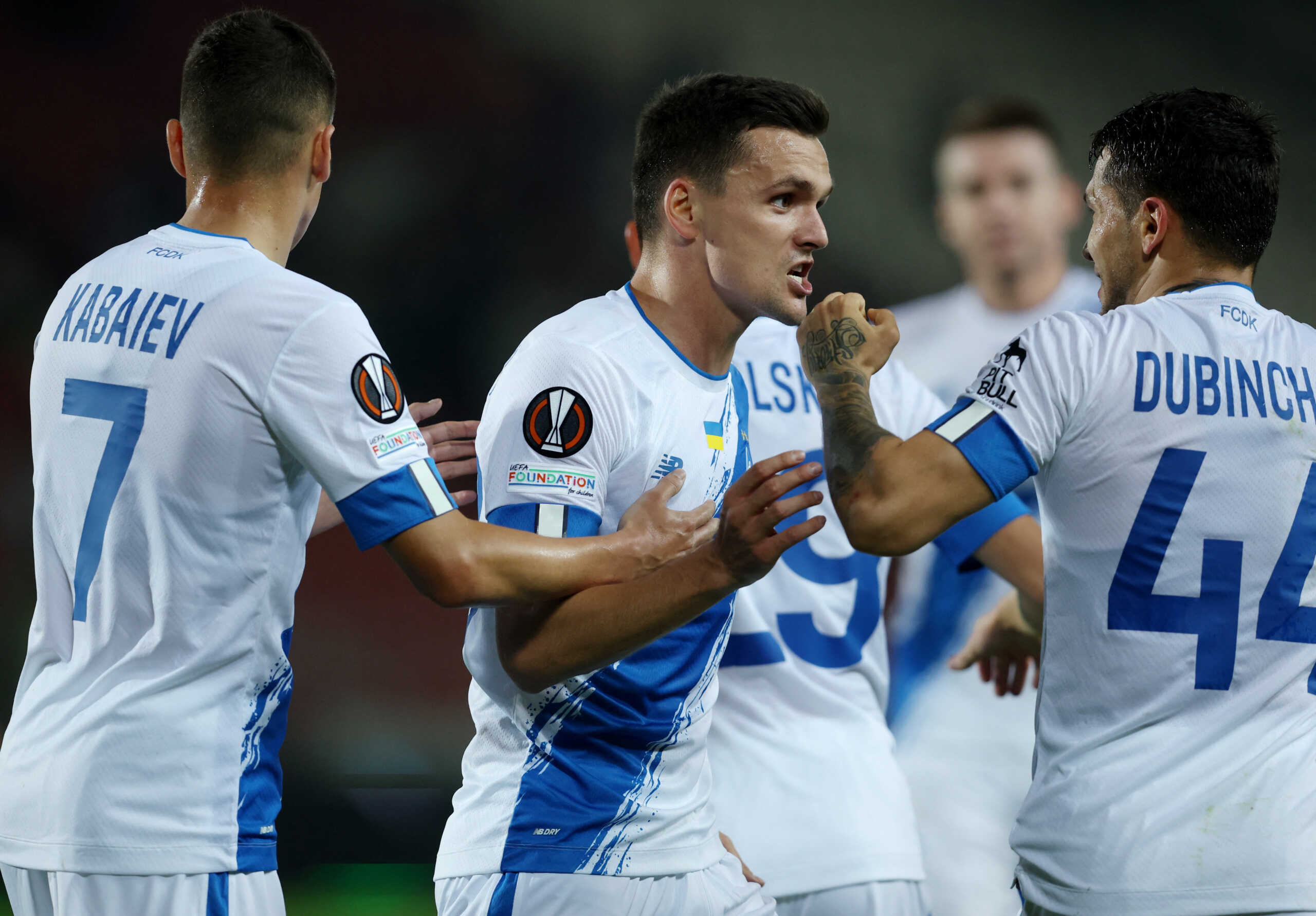 Soccer Football - Europa League - Group B - Dynamo Kyiv v AEK Larnaca - Marszalek Jozef Pilsudski Stadium, Krakow, Poland - September 15, 2022 Dynamo Kyiv's Vitaliy Buyalskyy celebrates scoring their first goal with Vladislav Kabaev and Vladyslav Dubinchak that was later disallowed after a VAR review REUTERS