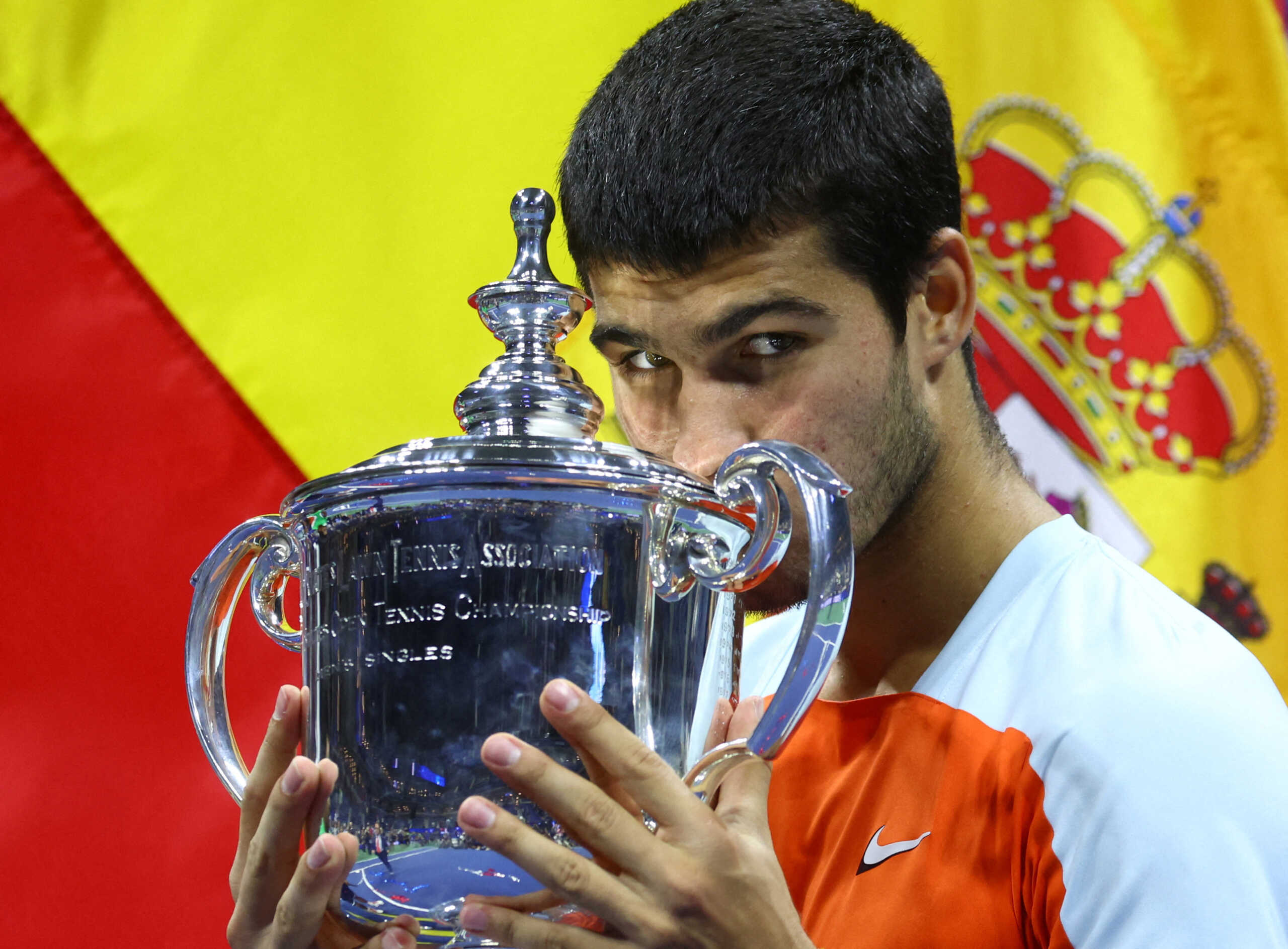 Tennis - U.S. Open - Flushing Meadows, New York, United States - September 11, 2022  Spain's Carlos Alcaraz celebrates with the trophy after winning the U.S. Open REUTERS