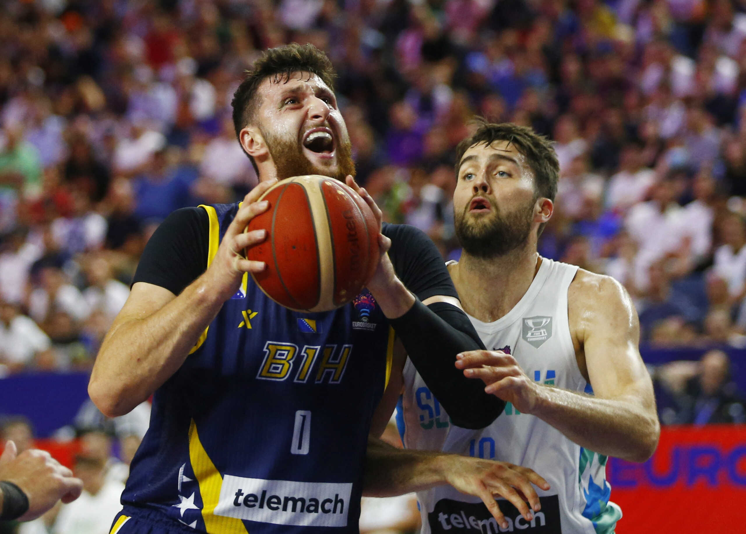 Basketball - EuroBasket Championship - Group B - Slovenia v Bosnia and Herzegovina - Cologne Arena, Cologne, Germany - September 4, 2022 Bosnia and Herzegovina's Jusuf Nurkic in action with Slovenia's Mike Tobey REUTERS