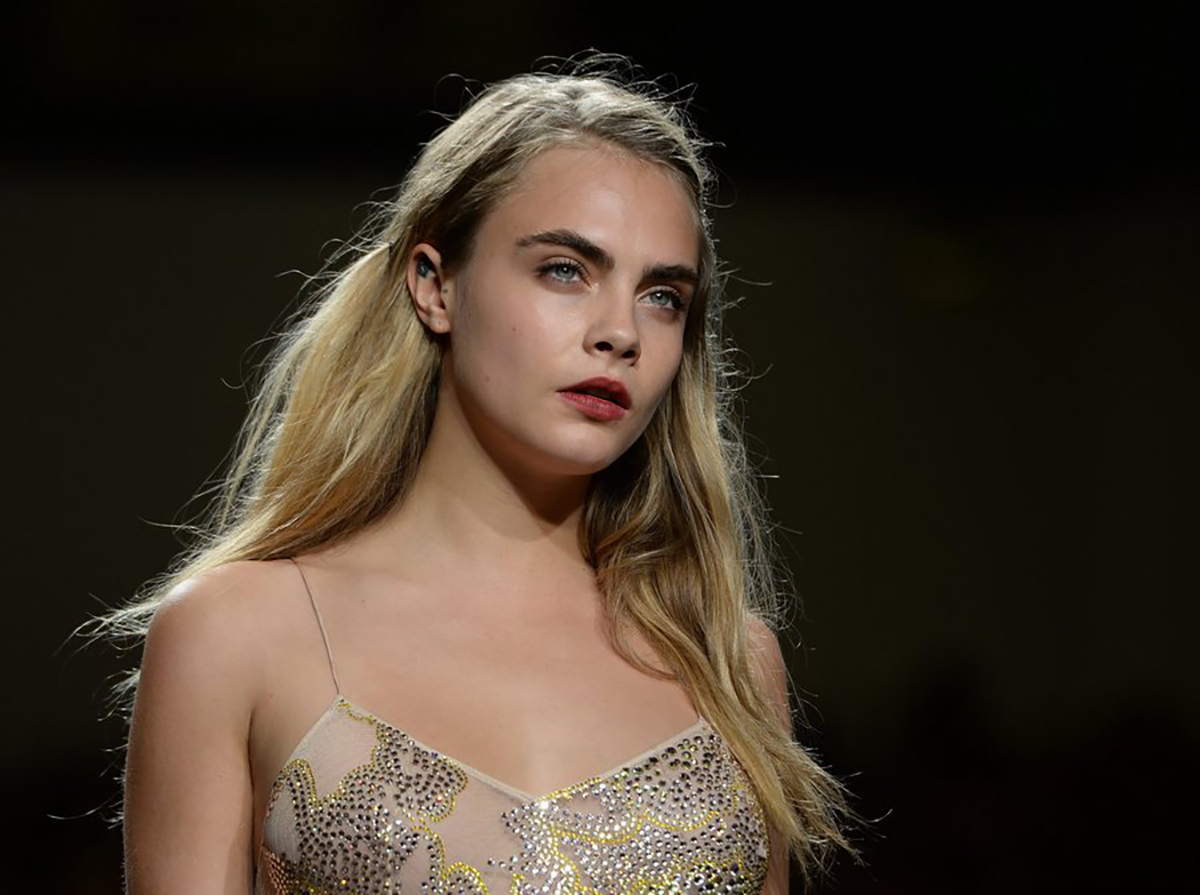 epa04400410 British model Cara Delevigne presents a creation from the Spring