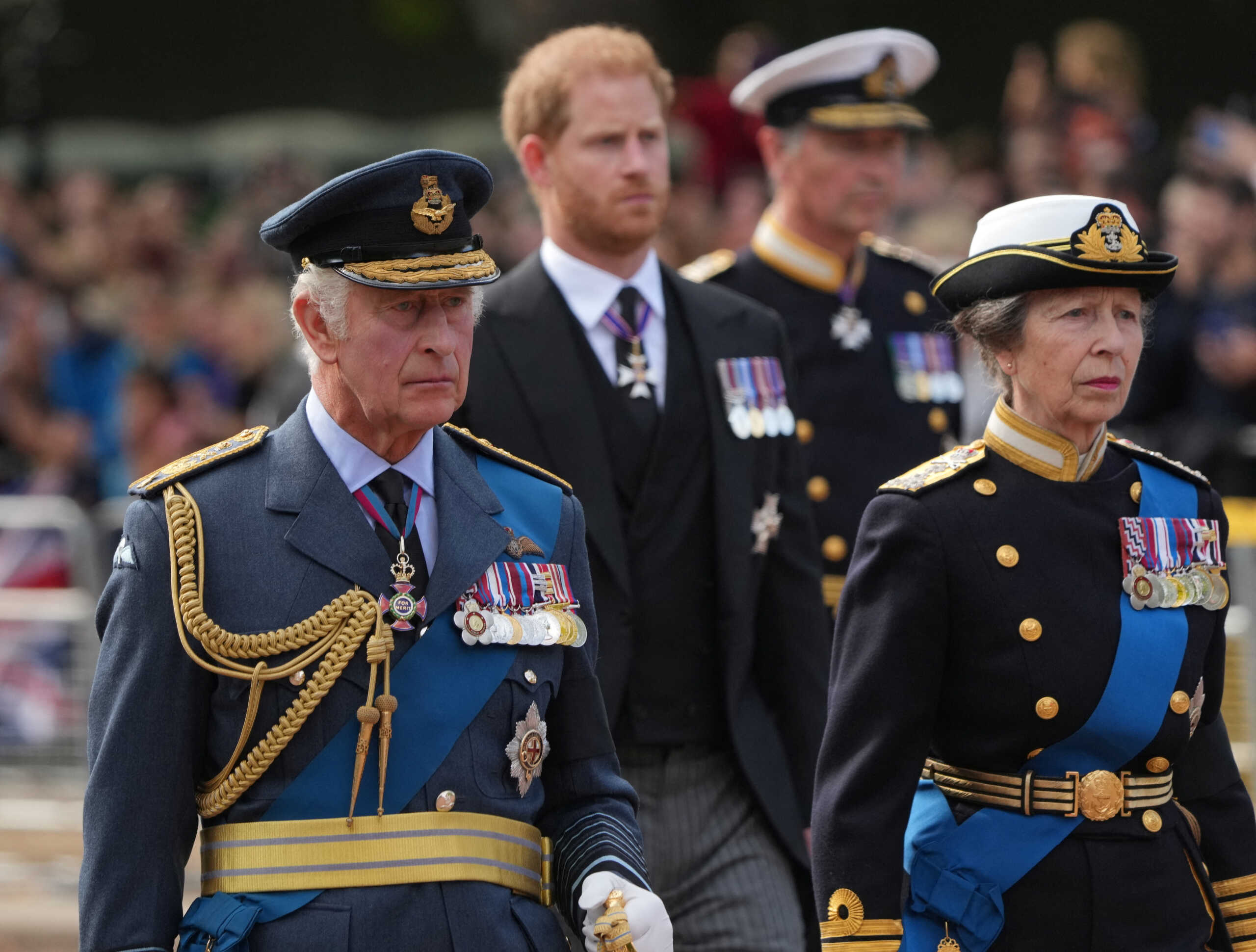 Britain's King Charles, Princess Anne, and Prince Harry march during the procession of the coffin of Britain's Queen Elizabeth from Buckingham Palace to the Houses of Parliament for her lying in state, in London, Britain, September 14, 2022.   REUTERS