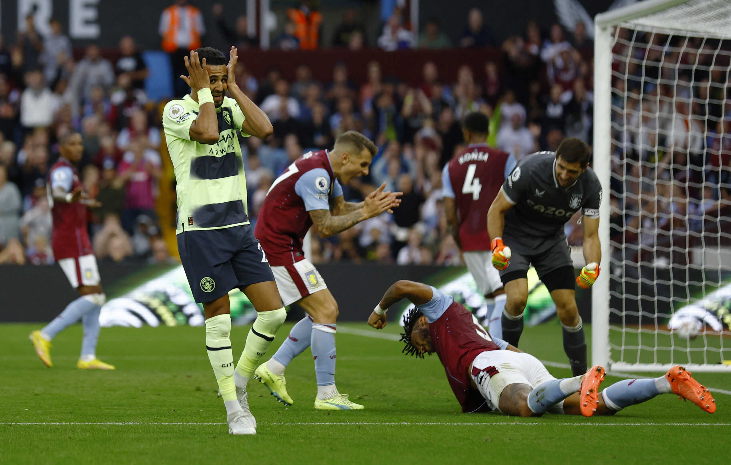 Soccer Football - Premier League - Aston Villa v Manchester City - Villa Park, Birmingham, Britain - September 3, 2022 Manchester City's Riyad Mahrez reacts after a missed chance as Aston Villa's Tyrone Mings, Lucas Digne and Emiliano Martinez celebrate Action Images via Reuters