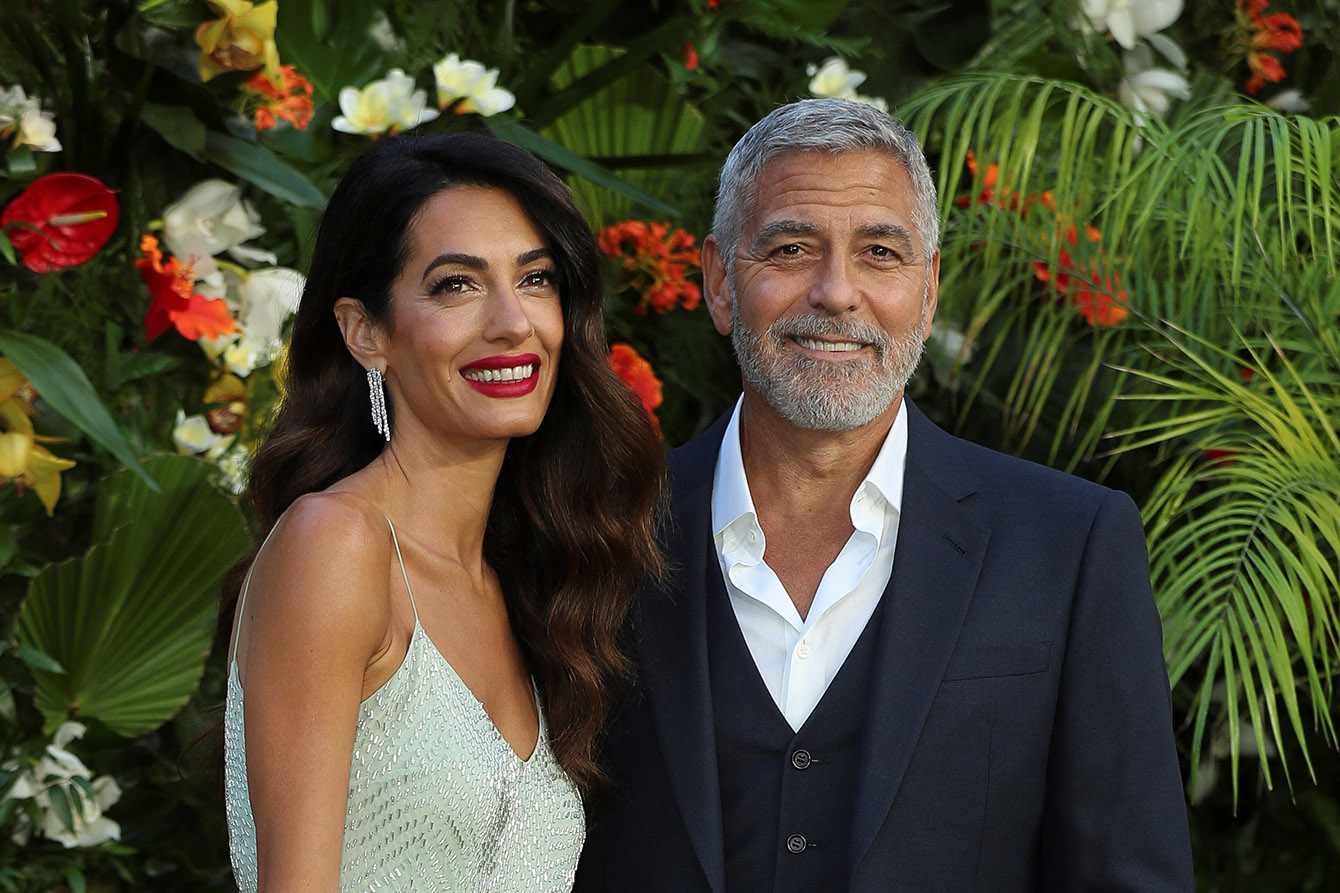 George Clooney and his wife Amal Clooney attend the world premiere of 'Ticket to Paradise' in London, Britain September 7, 2022. REUTERS
