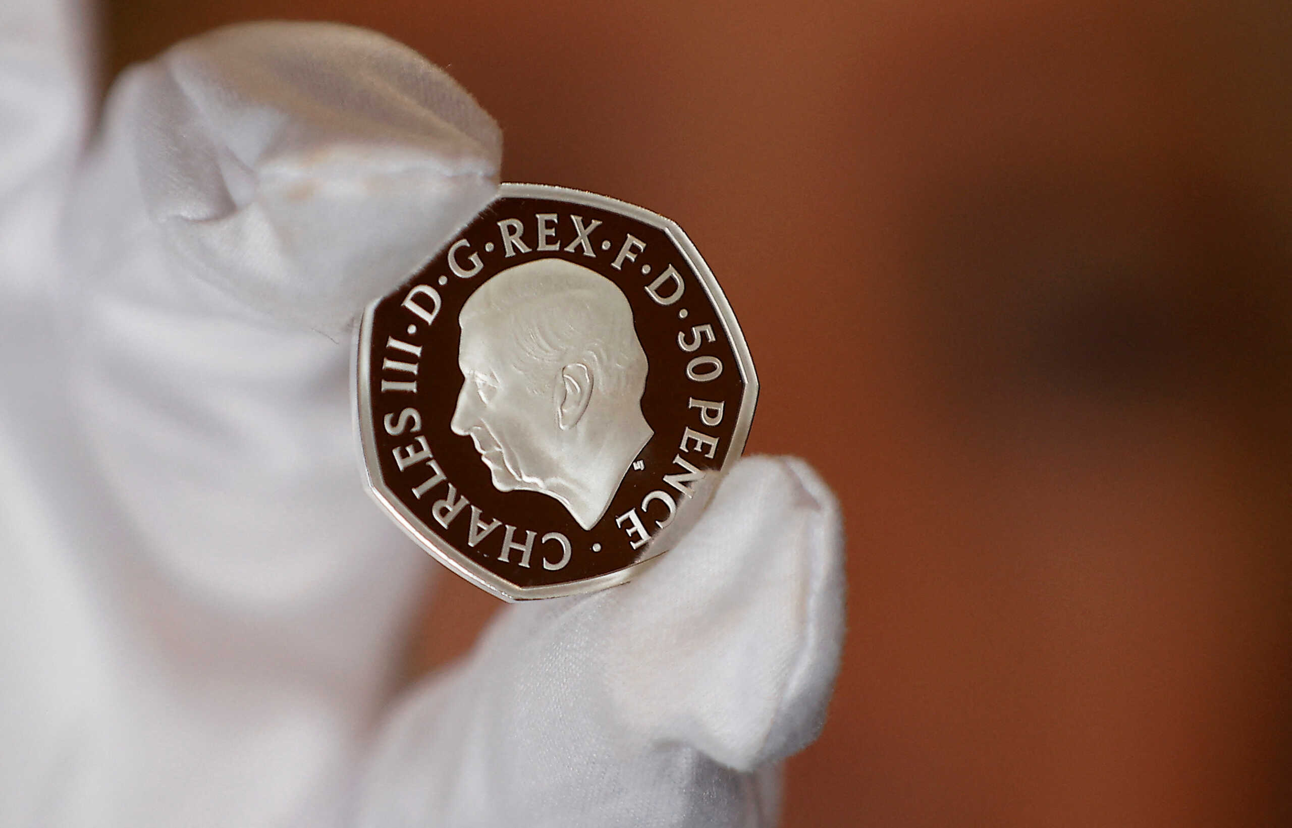The official coin effigy of Britain’s King Charles III is seen on a 50 pence coin, unveiled by The Royal Mint, in London, Britain, September 29, 2022.  REUTERS