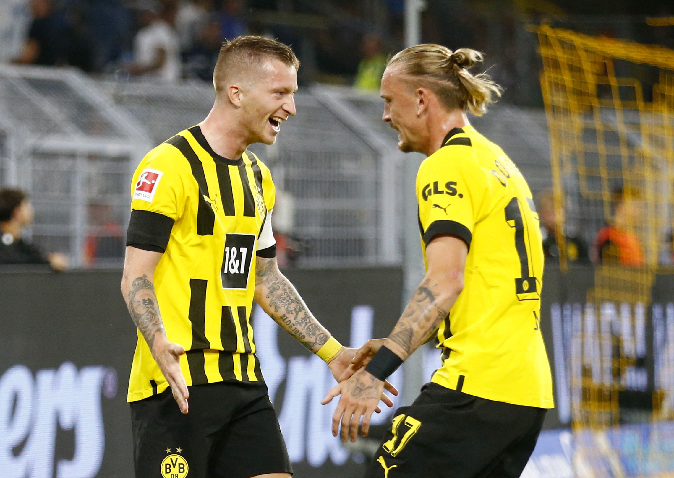 Soccer Football - Bundesliga - Borussia Dortmund v TSG 1899 Hoffenheim - Signal Iduna Park, Dortmund, Germany - September 2, 2022  Borussia Dortmund's Marco Reus celebrates scoring their first goal with Marius Wolf REUTERS