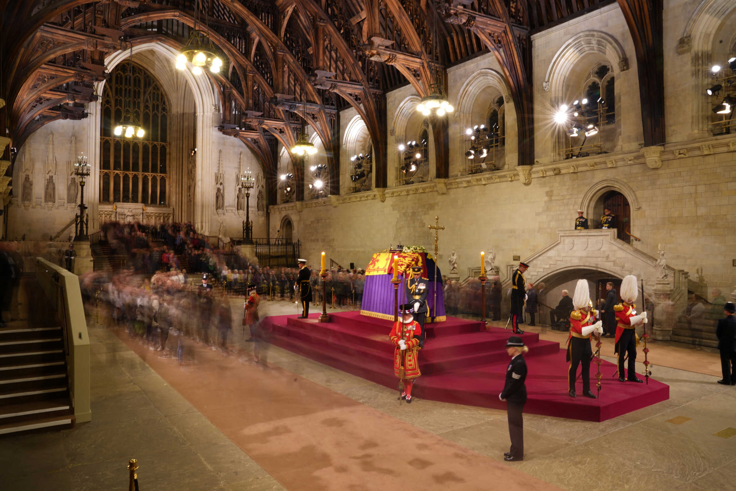 Members of the public file past the coffin of Queen Elizabeth II, draped in the Royal Standard with the Imperial State Crown and the Sovereign's orb and sceptre, lying in state on the catafalque in Westminster Hall, at the Palace of Westminster, in London, Britain September 17, 2022.  James Manning