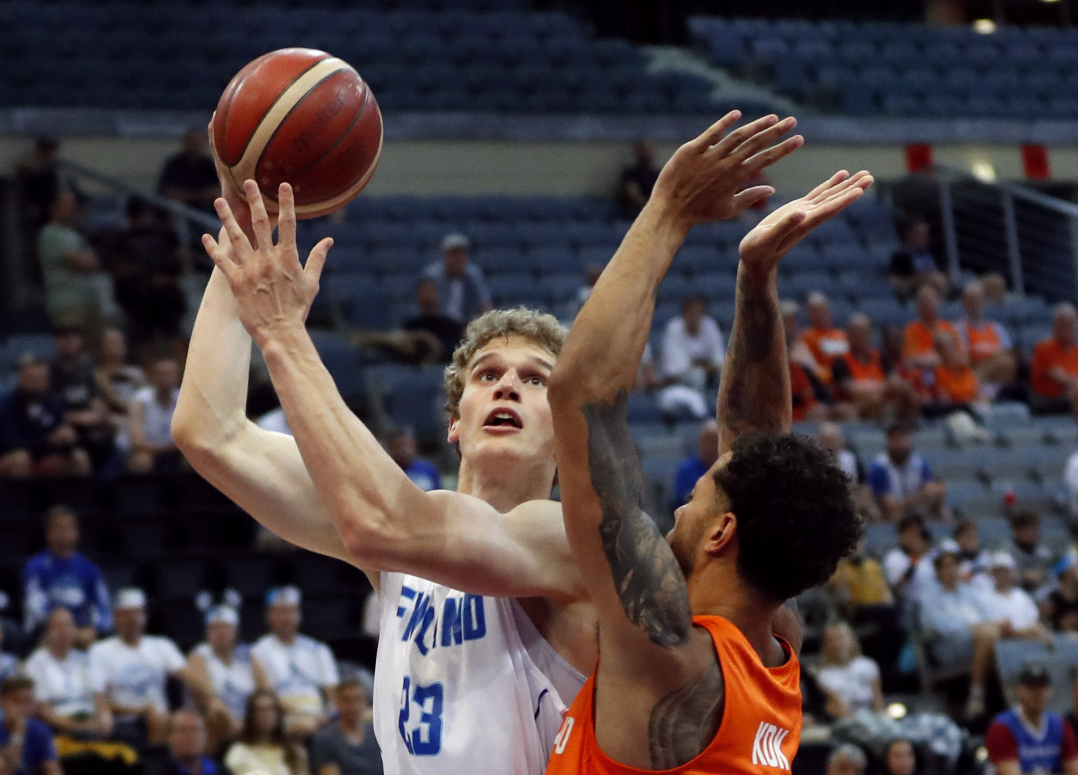 Basketball - EuroBasket Championship - Group D - Finland v Netherlands - Prague Arena, Prague, Czech Republic - September 8, 2022  Finland's Lauri Markkanen in action with Netherlands' Jito Kok REUTERS