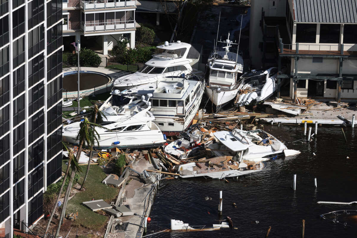 An aerial view of boats crashed in a harbor after Hurricane Ian caused widespread destruction in Fort Myers Beach, Florida, U.S., September 29, 2022. REUTERS