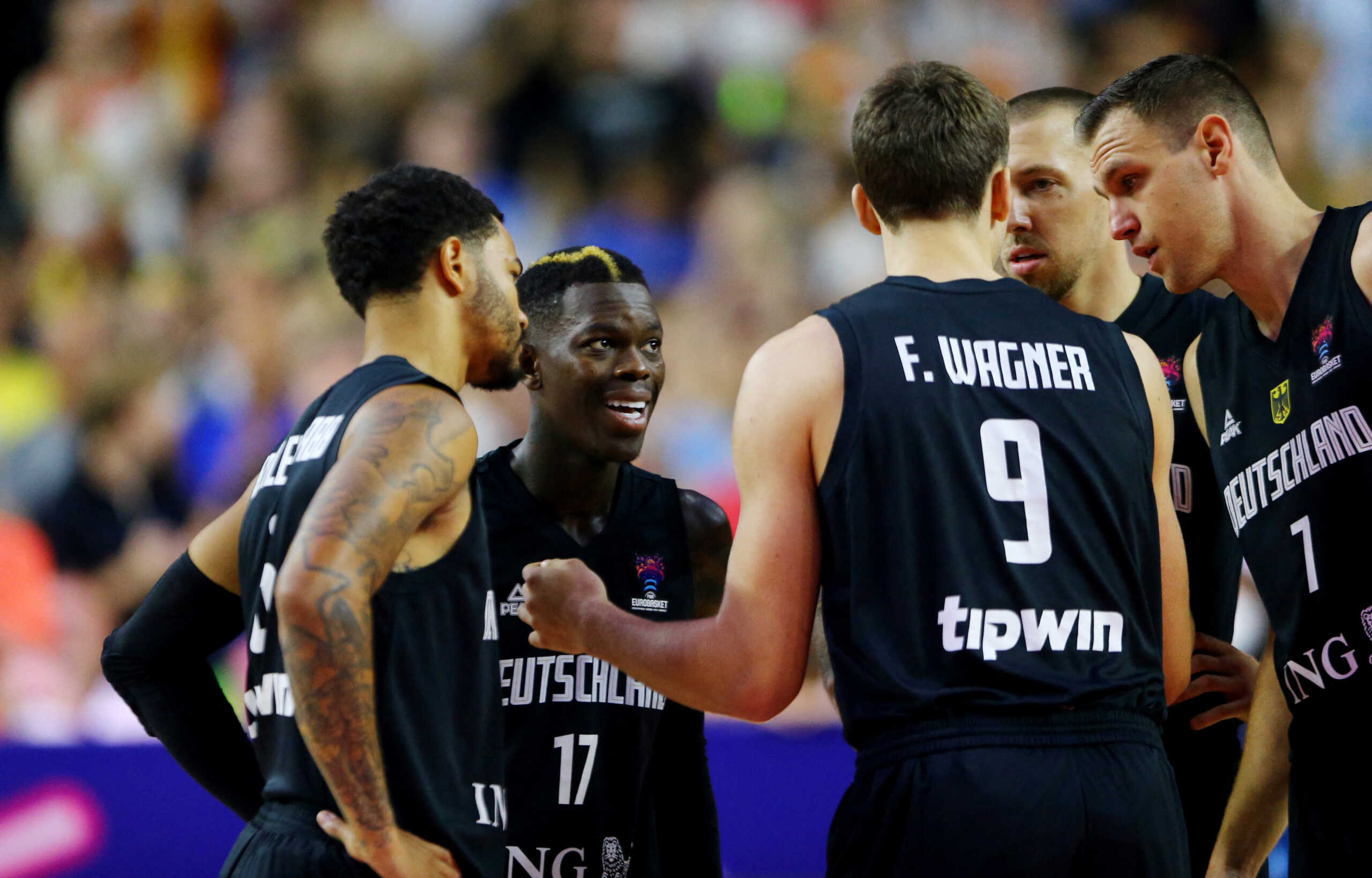 Basketball - EuroBasket Championship - Group B - Lithuania v Germany - Cologne Arena, Cologne, Germany - September 4, 2022 Germany's Dennis Schroder and Franz Wagner talk to teammates before the match REUTERS