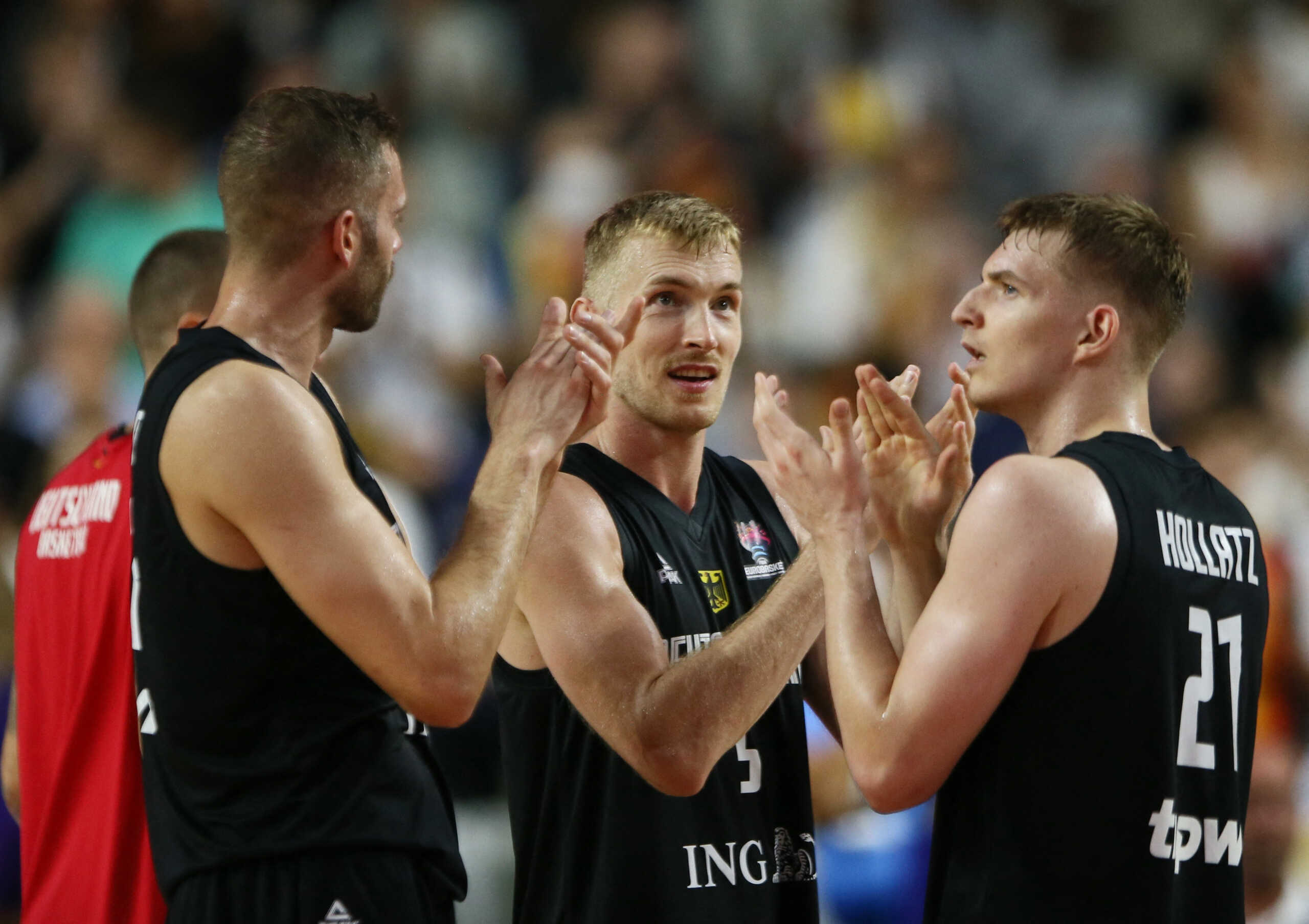Basketball - EuroBasket Championship - Group B - Hungary v Germany - Cologne Arena, Cologne, Germany - September 7, 2022 Germany's Niels Giffey celebrates after the match with teammates REUTERS