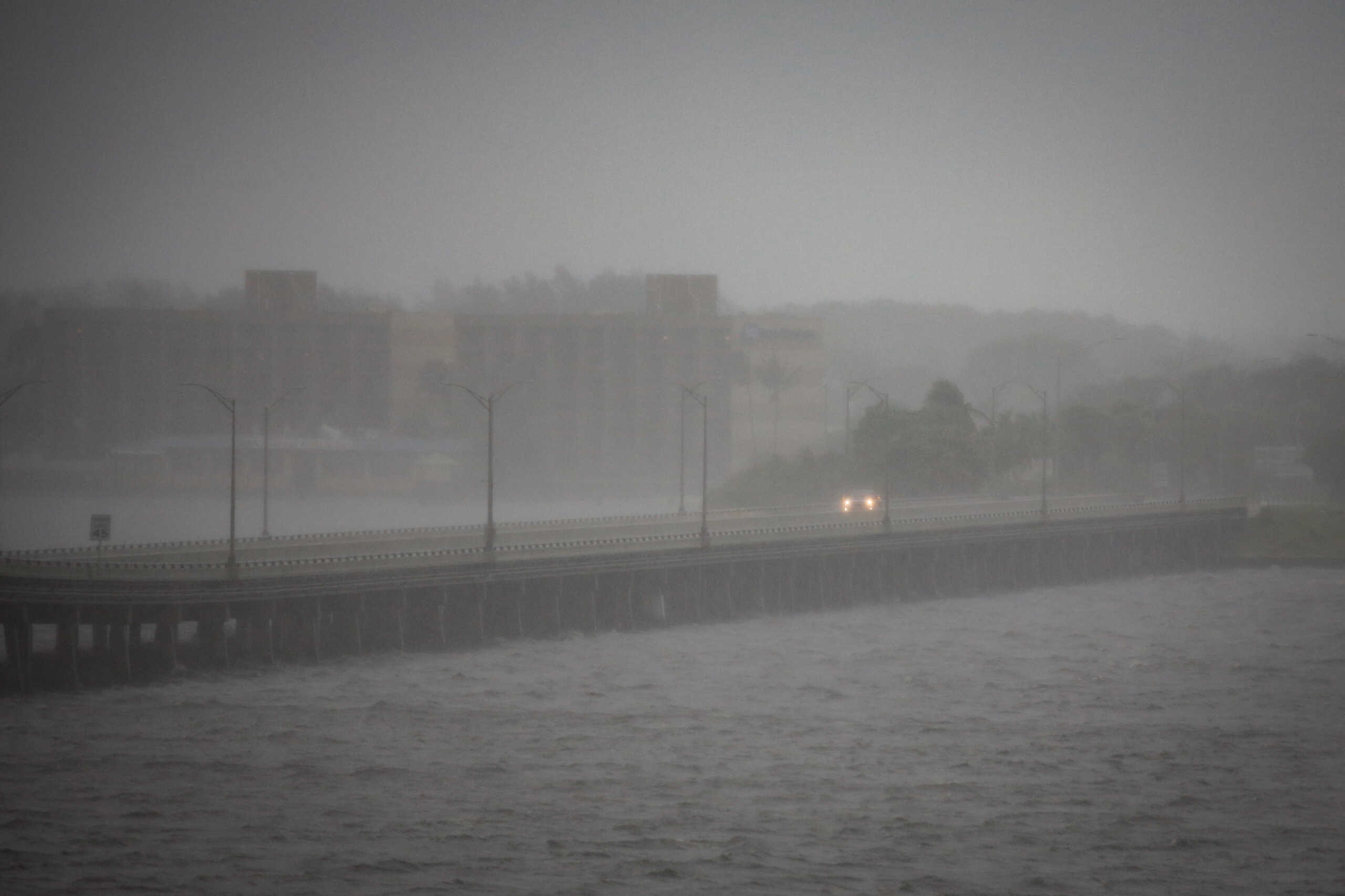 A car is seen on Caloosahatchee Bridge ahead of Hurricane Ian, in Fort Myers, Florida, U.S. September 28, 2022. REUTERS