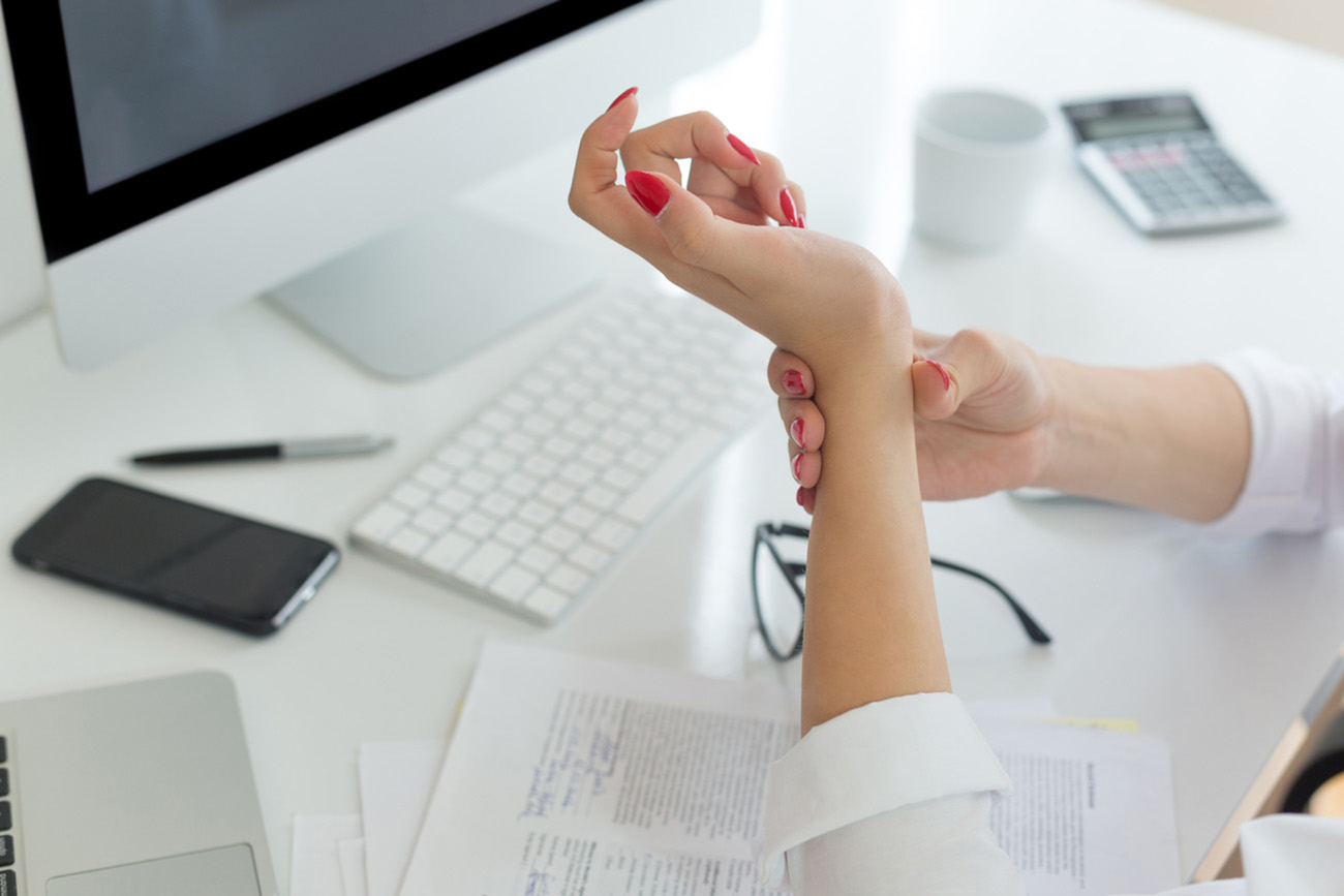 Business woman with wrist pain