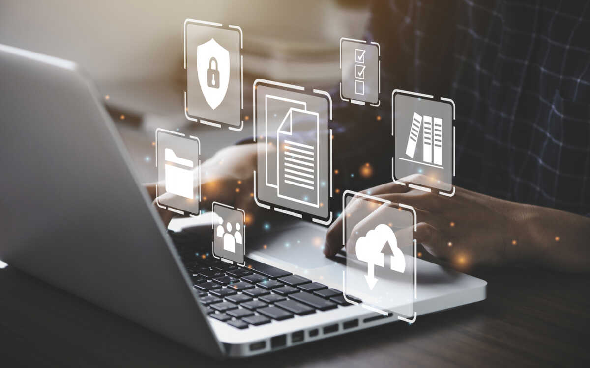 Businessman using a computer to document management concept, online documentation database and digital file storage system