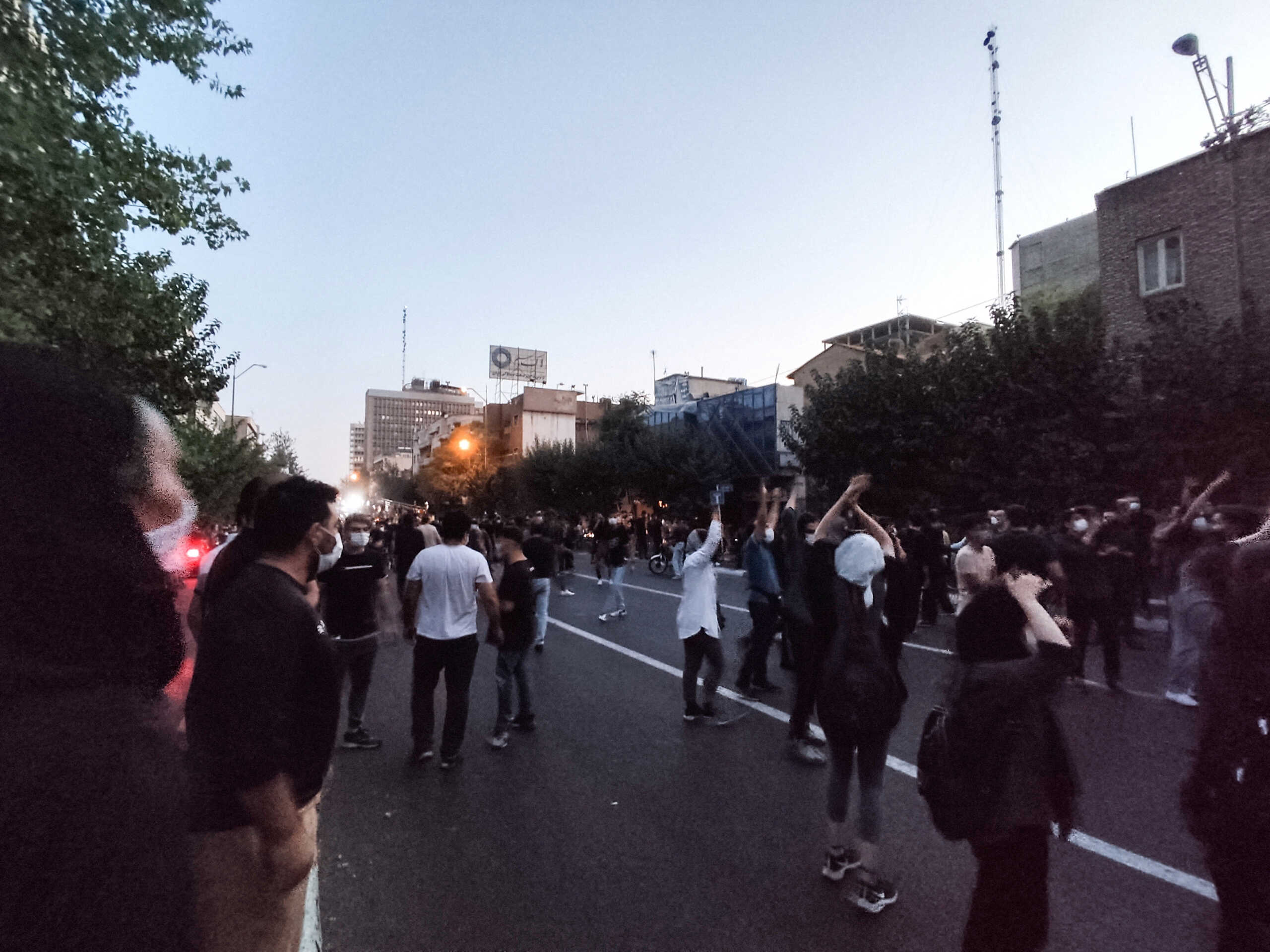 People attend a protest over the death of Mahsa Amini, a woman who died after being arrested by the Islamic republic's "morality police", in Tehran, Iran September 21, 2022. WANA (West Asia News Agency) via REUTERS ATTENTION EDITORS - THIS IMAGE HAS BEEN SUPPLIED BY A THIRD PARTY. BEST QUALITY AVAILABLE DUE TO LIGHTING CONDITIONS