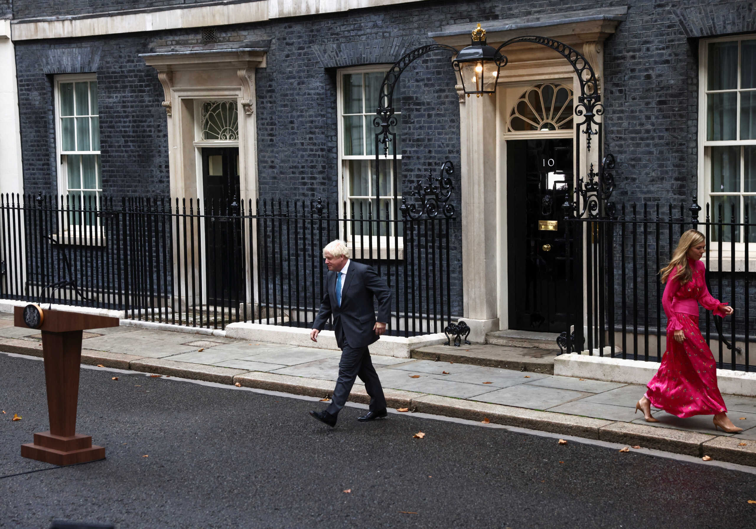 Outgoing British Prime Minister Boris Johnson, with his wife Carrie Johnson, walk outside Downing Street, in London, Britain September 6, 2022. REUTERS