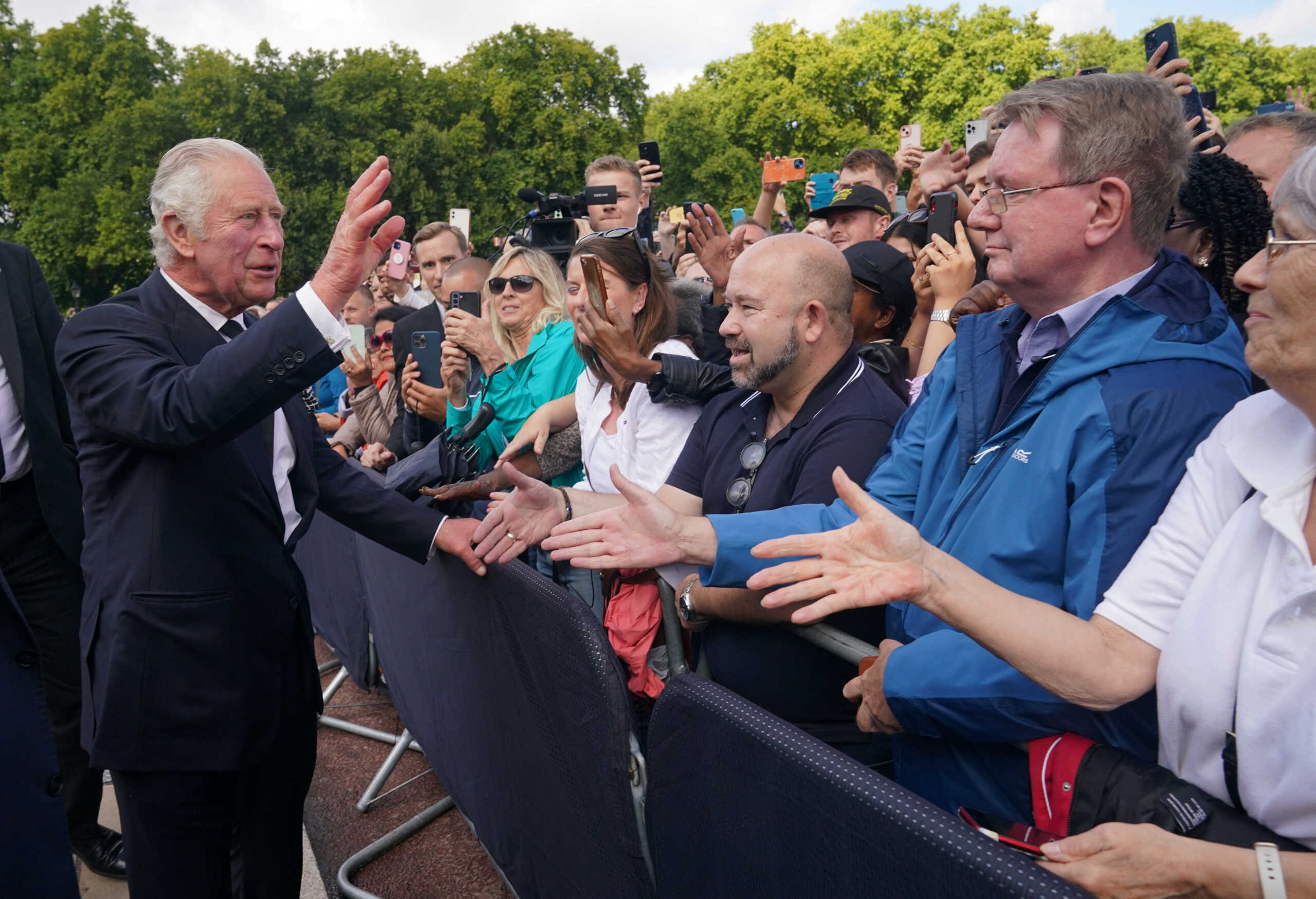 King Charles III is greeted by well-wishers during a walkabout to view tributes left outside Buckingham Palace, London, following the death of Queen Elizabeth II on Thursday. Picture date: Friday September 9, 2022. Yui Mok