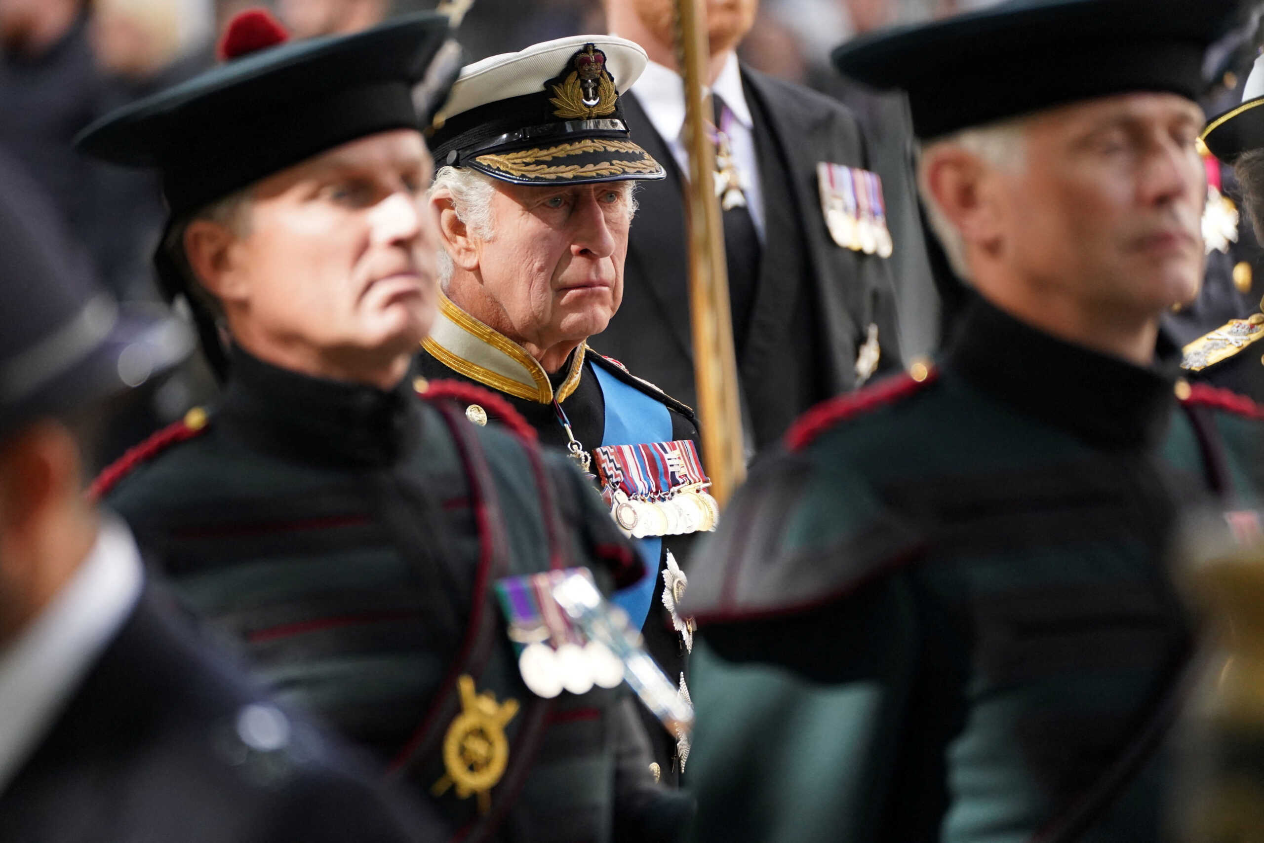 King Charles III follows the coffin of Queen Elizabeth II, draped in the Royal Standard with the Imperial State Crown and the Sovereign's orb and sceptre, as it leaves Westminster Abbey after the State Funeral of Queen Elizabeth II at Westminster Abbey, London. Picture date: Monday September 19, 2022. James Manning
