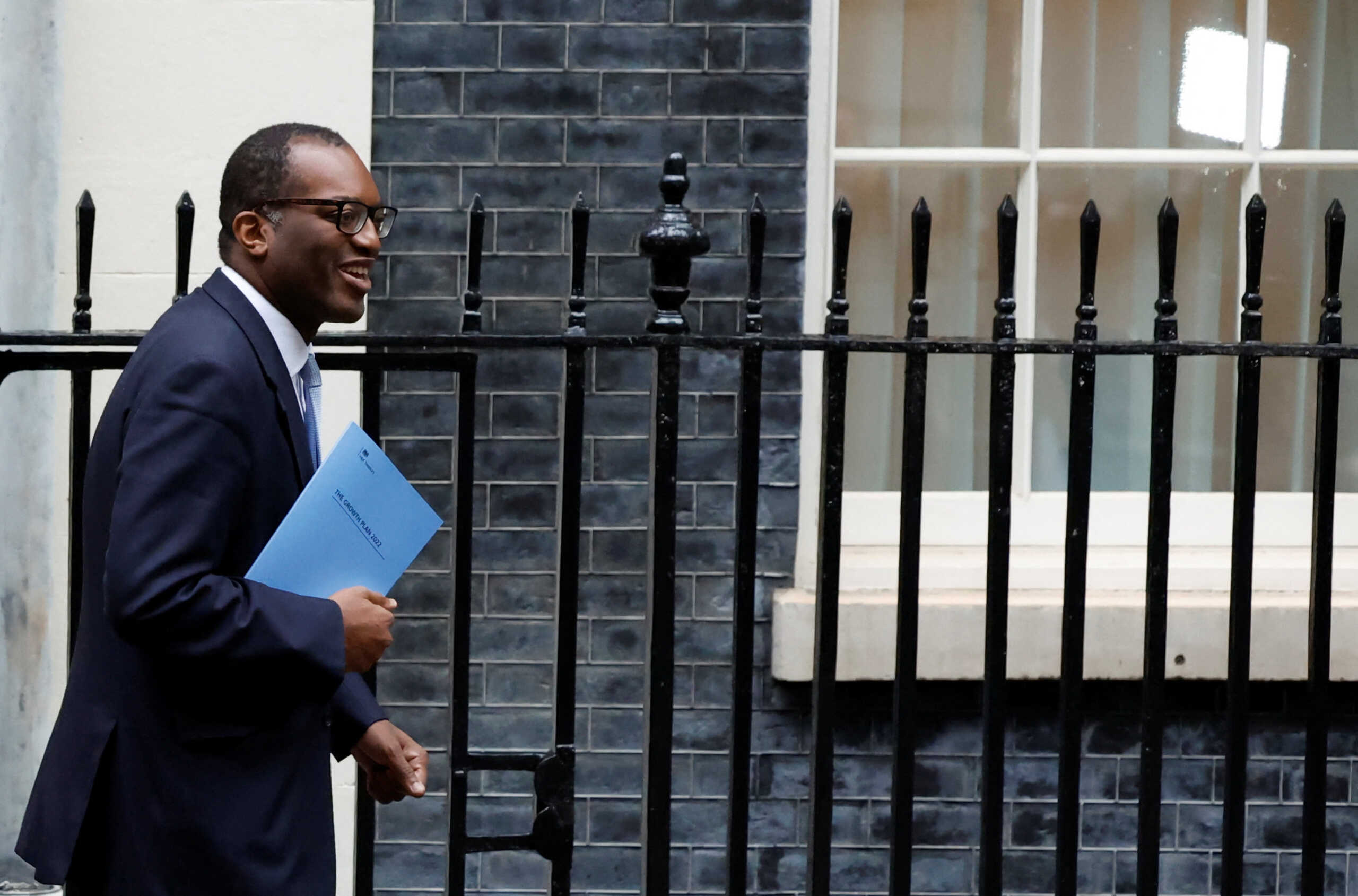 Britain's Chancellor of the Exchequer Kwasi Kwarteng walks outside Downing Street in London, Britain, September 23, 2022. REUTERS