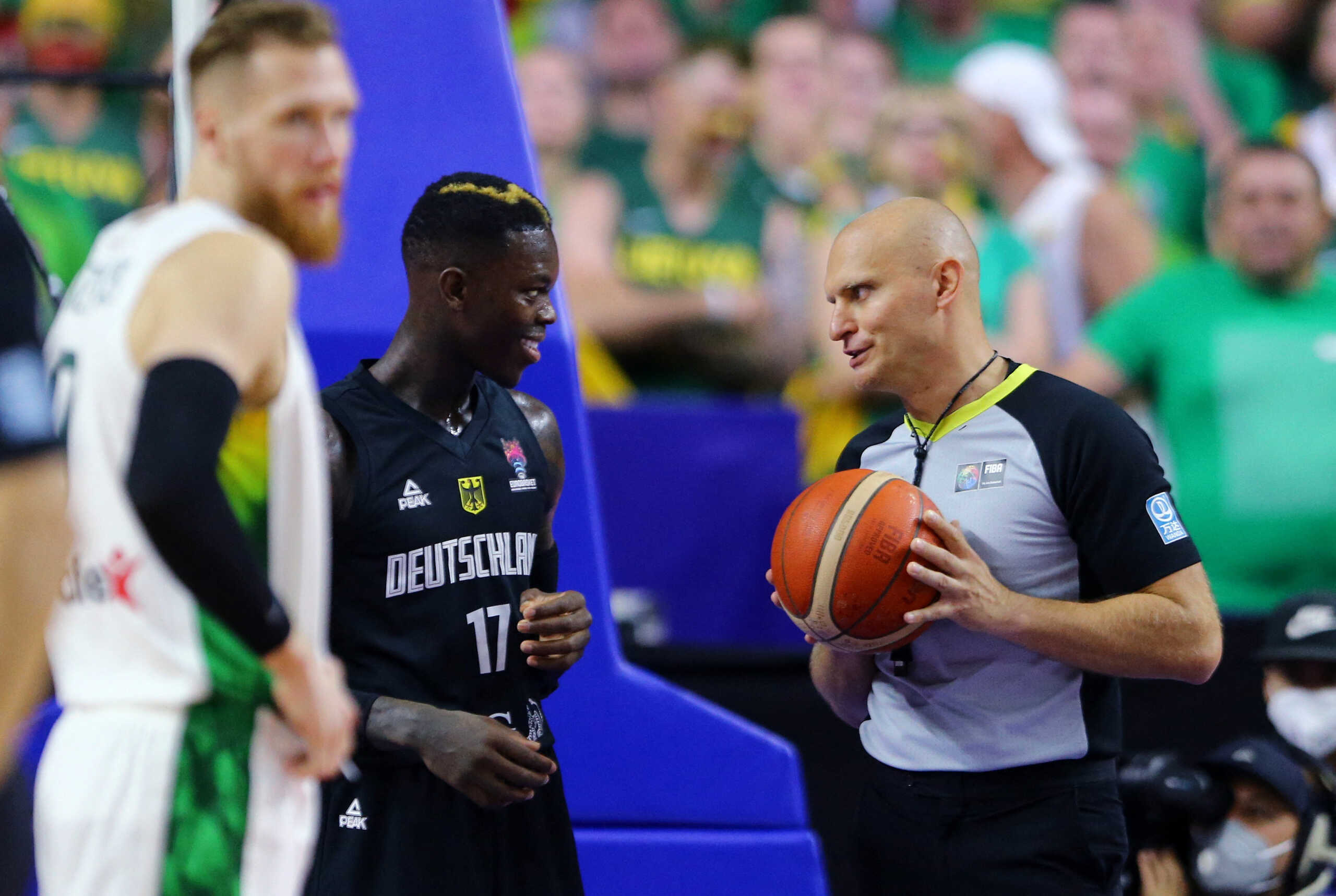 Basketball - EuroBasket Championship - Group B - Lithuania v Germany - Cologne Arena, Cologne, Germany - September 4, 2022 Germany's Dennis Schroder talks to referee Michal Proc REUTERS