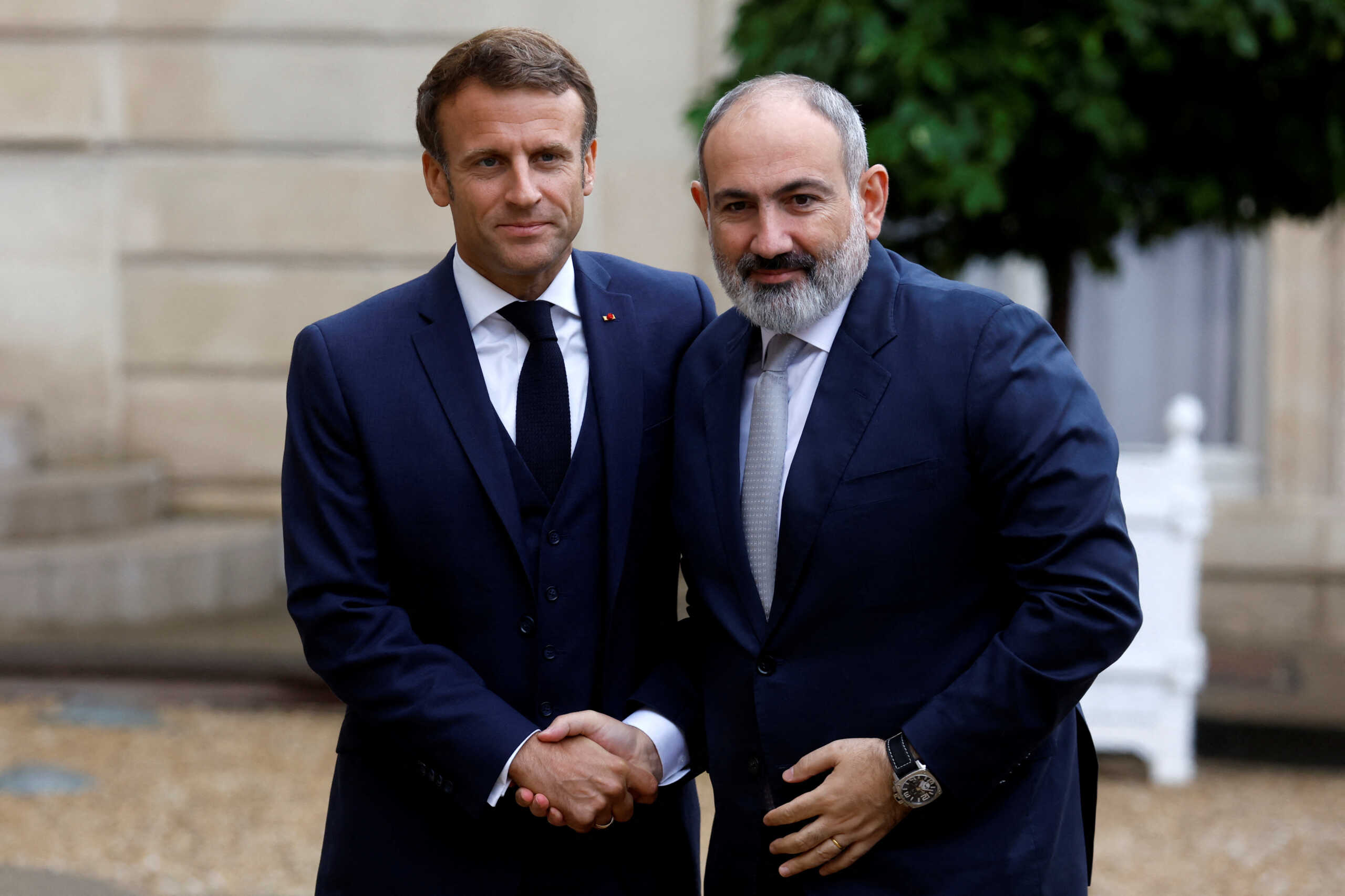 French President Emmanuel Macron welcomes Armenian Prime Minister Nikol Pashinyan at the Elysee Palace in Paris, France, September 26, 2022. REUTERS