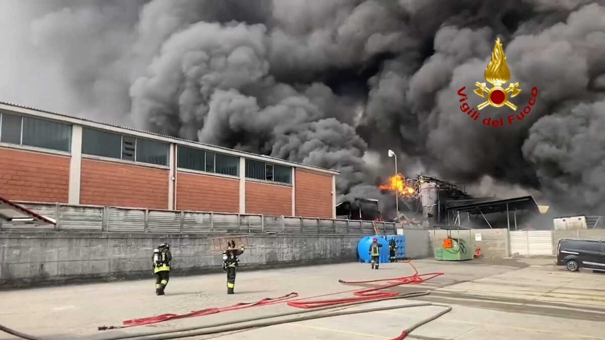 Fire brigade members work to put out a fire at the Nitrolchimica chemical plant in this still image taken from video in San Giuliano Milanese near Milan, Italy, September 7, 2022. Vigili del Fuoco