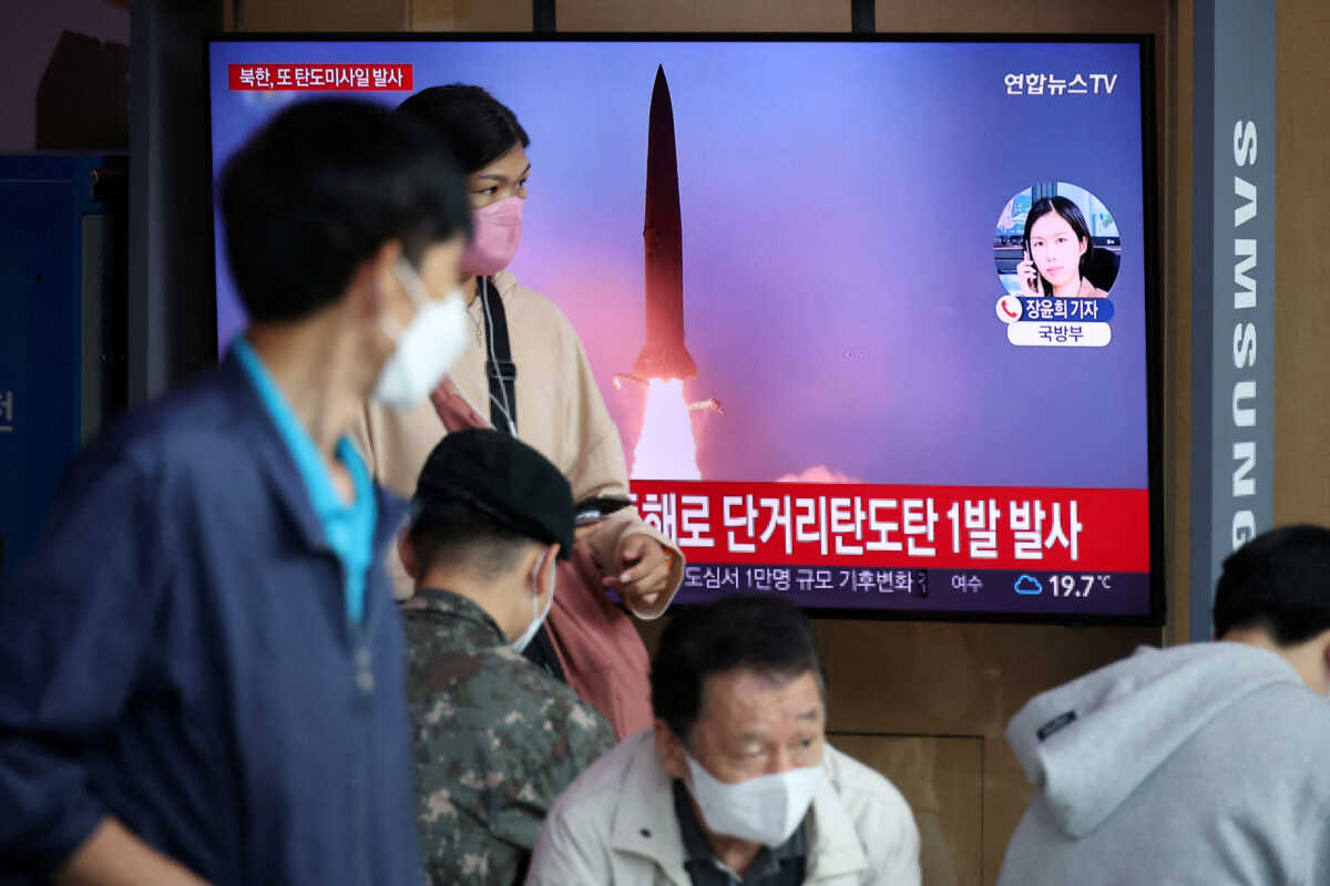 People watch a TV broadcasting a news report on North Korea firing a ballistic missile towards the sea off its east coast, in Seoul, South Korea, September 25, 2022.   REUTERS