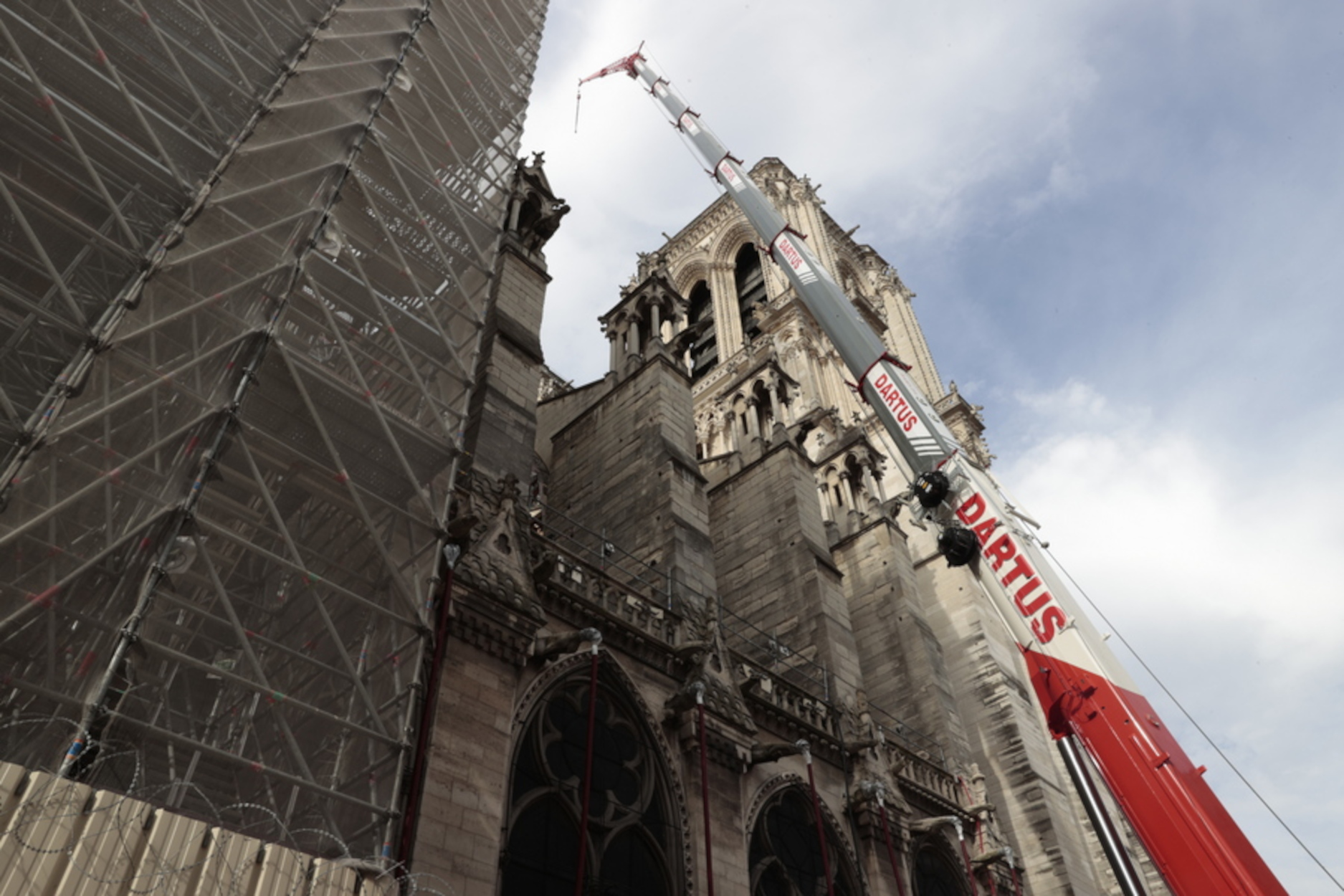 epa10095414 Reconstruction works on the site of the Notre-Dame de Paris Cathedral is pictured in Paris, France, 28 July 2022, as part of a visit of France's Culture Minister Rima Abdul-Malak. A little more than three years after the spectacular fire that damaged this masterpiece of Gothic art on 15 April 2019, the timetable is tight to respect the presidential promise to rebuild the cathedral in 5 years.  EPA