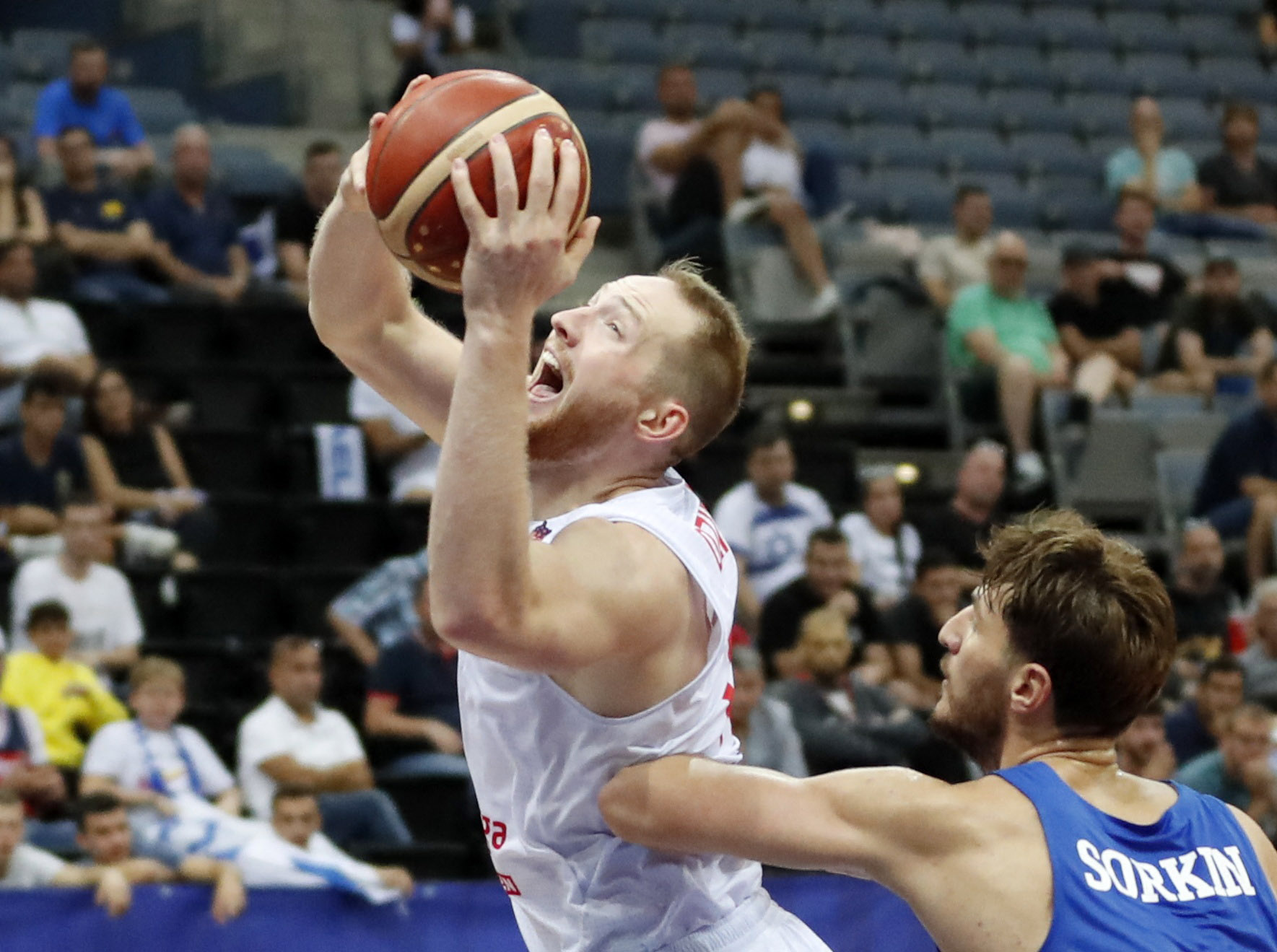 Basketball - EuroBasket Championship - Group D - Poland v Israel - Prague Arena, Prague, Czech Republic - September 5, 2022 Poland's Aleksander Dziewa in action with Israel's Roman Sorkin REUTERS