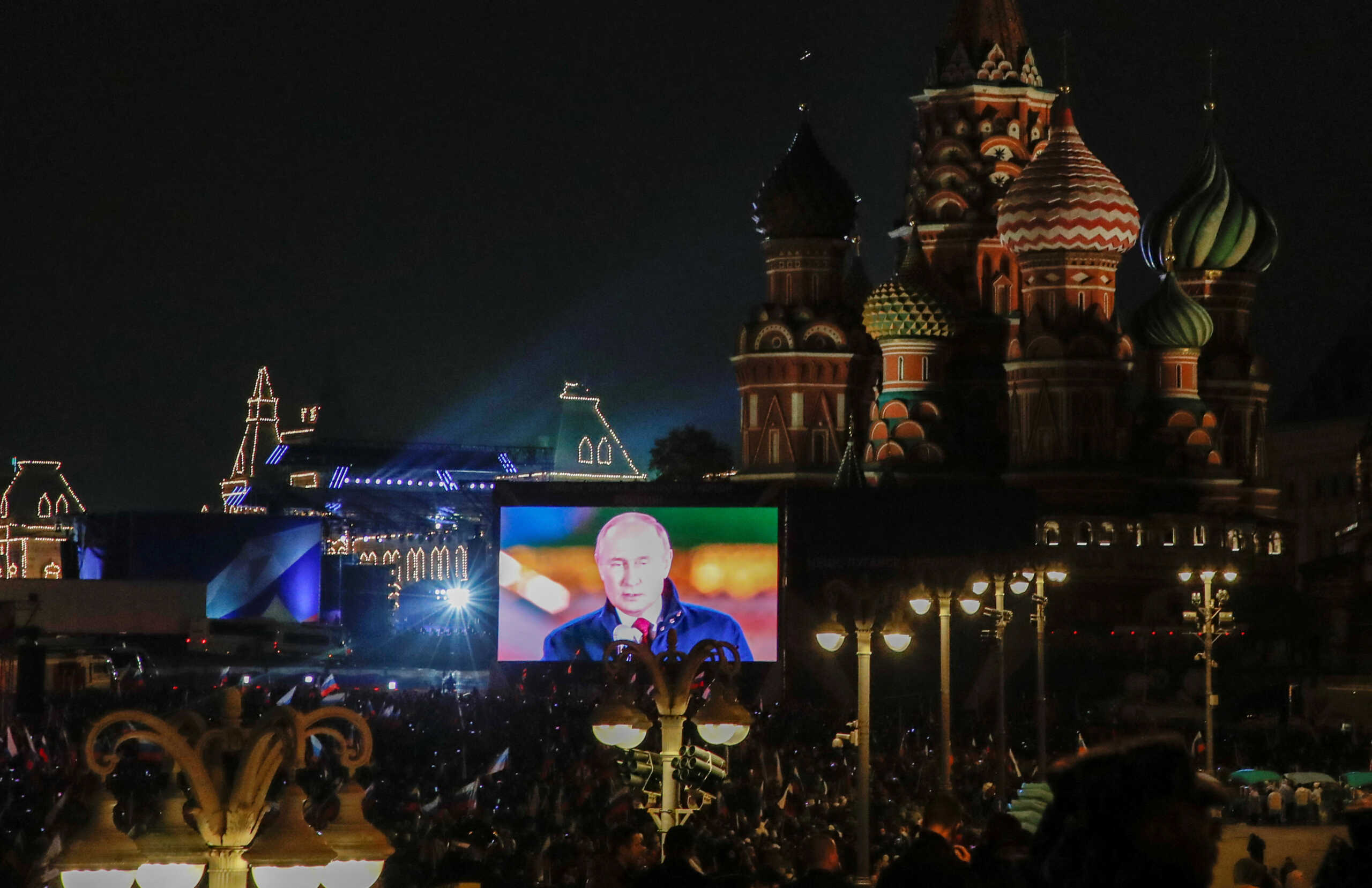 Russian President Vladimir Putin is seen on a screen during the broadcast of a concert marking the declared annexation of the Russian-controlled territories of four Ukraine's Donetsk, Luhansk, Kherson and Zaporizhzhia regions, after holding what Russian authorities called referendums in the occupied areas of Ukraine that were condemned by Kyiv and governments worldwide, near St. Basil's Cathedral and Red Square in central Moscow, Russia, September 30, 2022. REUTERS