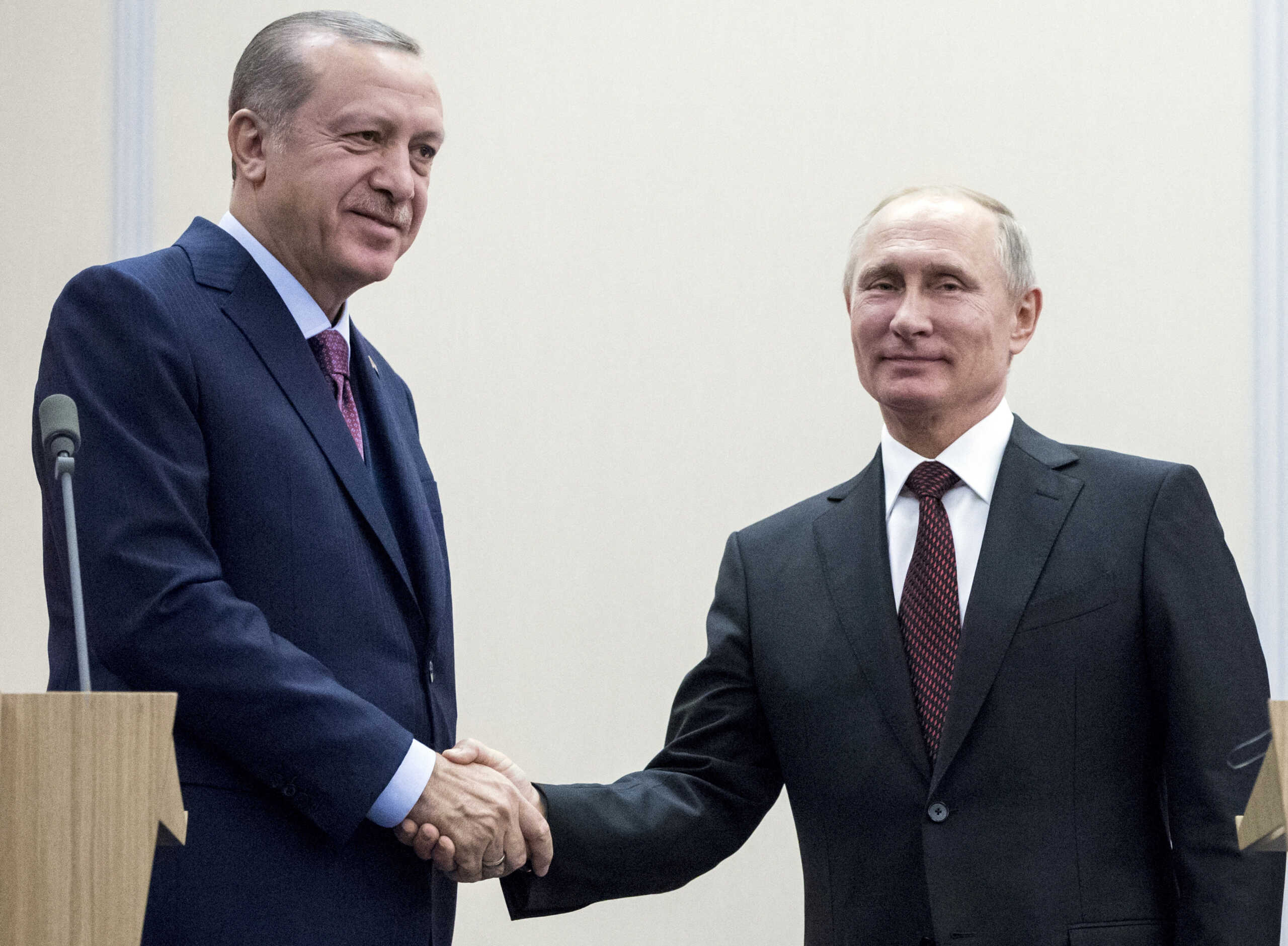 FILE PHOTO: Russia's President Vladimir Putin (R) shakes hands with Turkey's President Tayyip Erdogan during a meeting in Sochi, Russia November 13, 2017. REUTERS